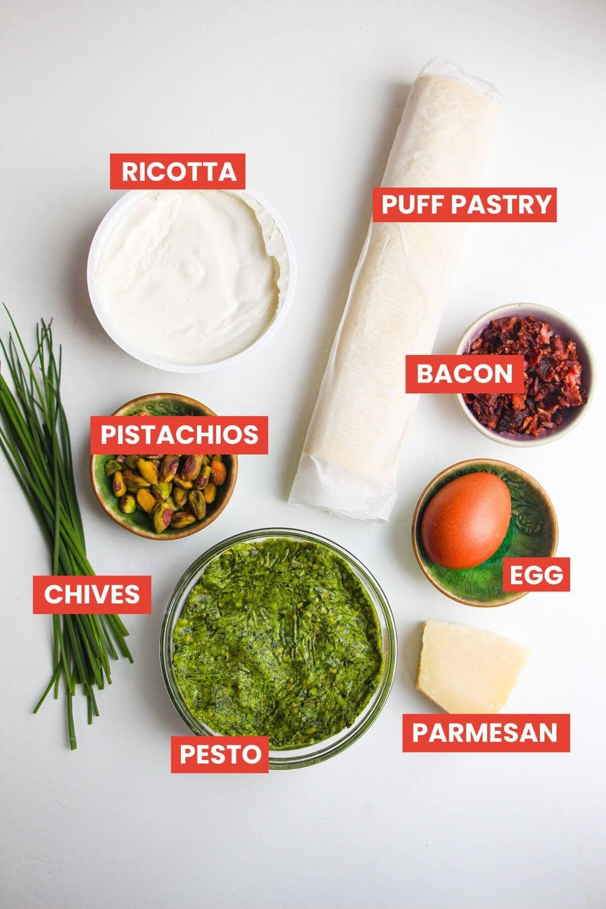 Ingredients for pesto ricotta bites laid out and labelled.
