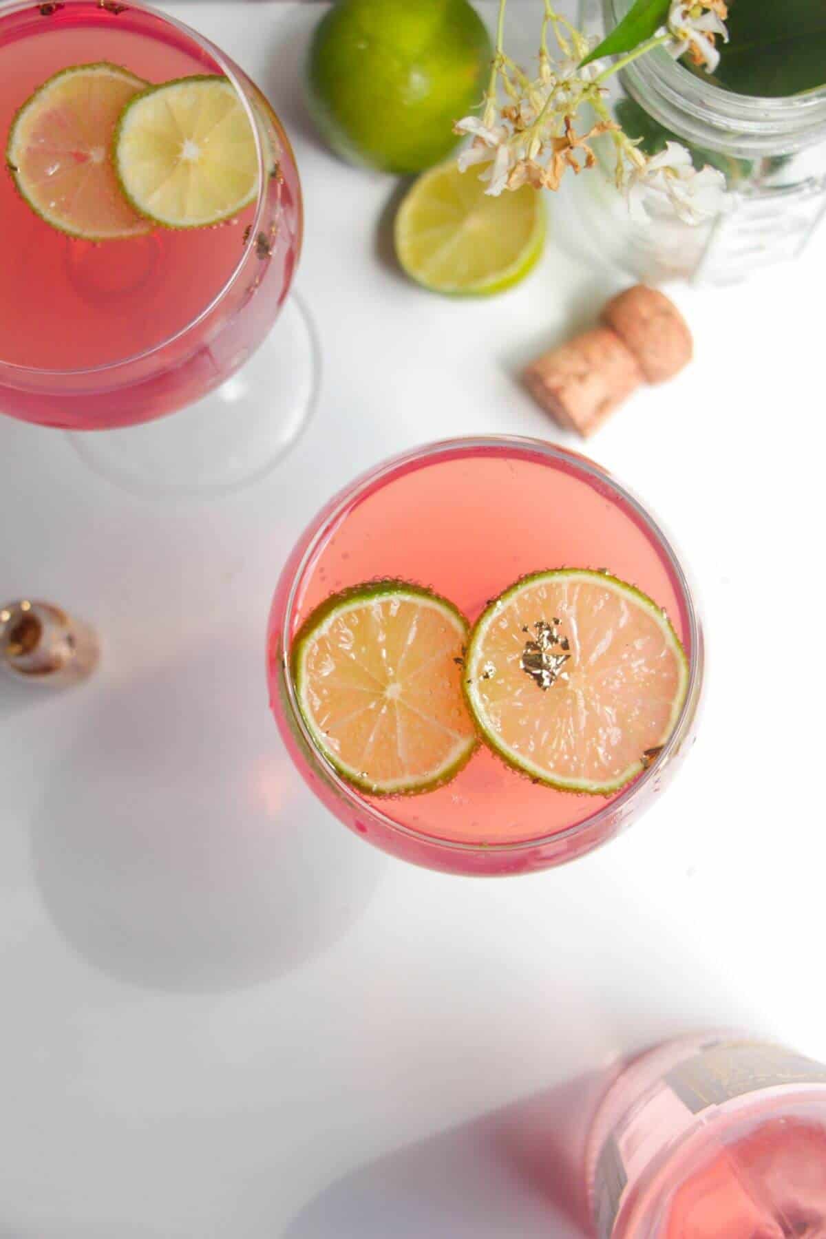 2 pink barbie spritz drinks in coupe's, view from above.