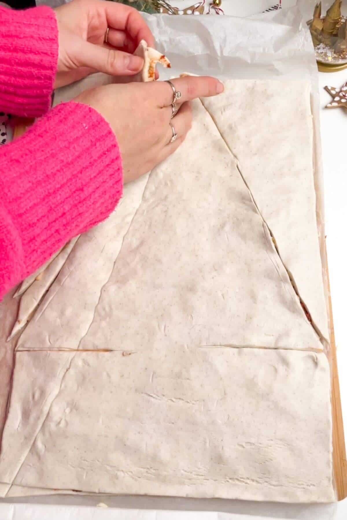 Forming triangle in puff pastry.