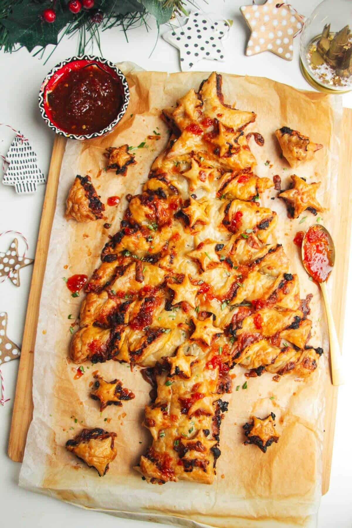 Puff pastry Christmas tree on a wooden board.