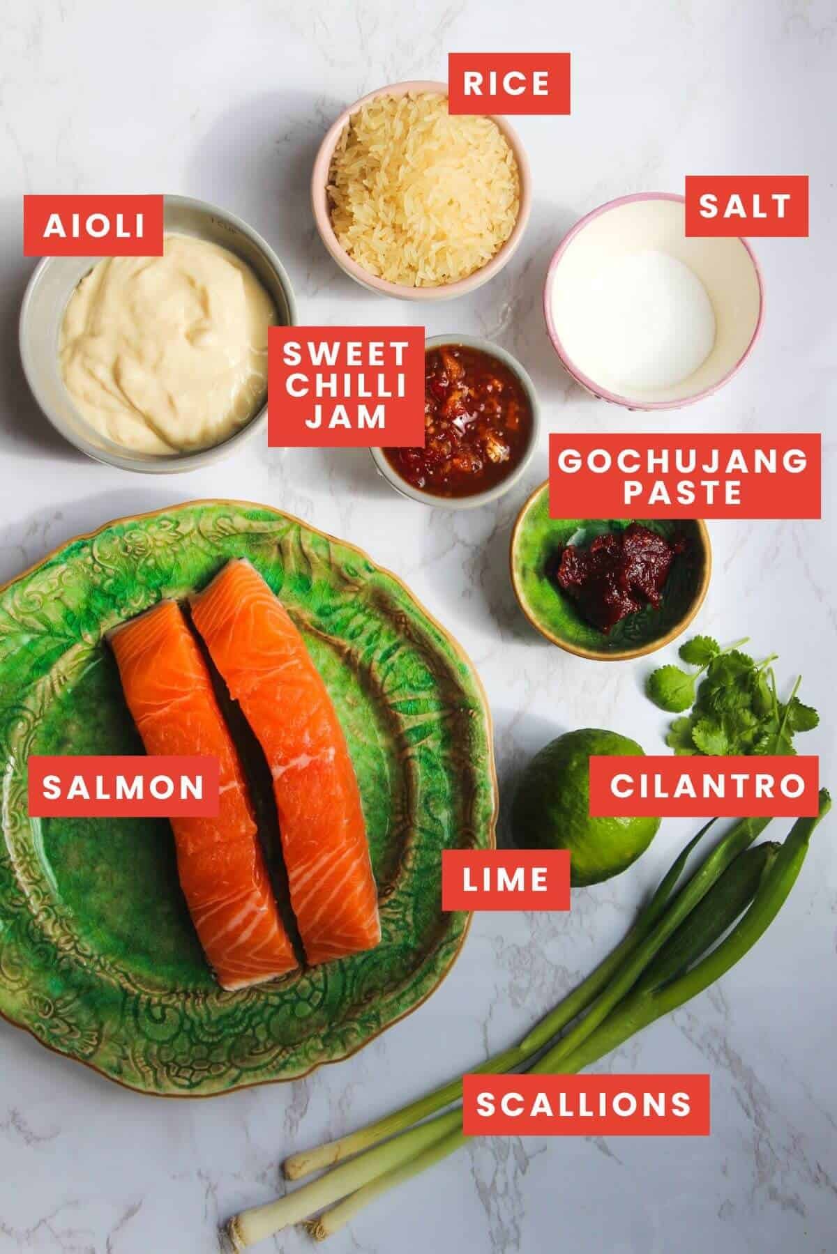 Ingredients for Bang Bang Salmon laid out on a white marble surface and labelled.