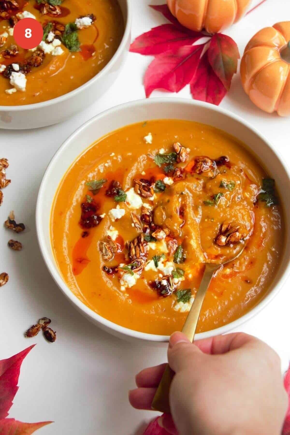 Butternut squash soup topped with chili oil and feta.