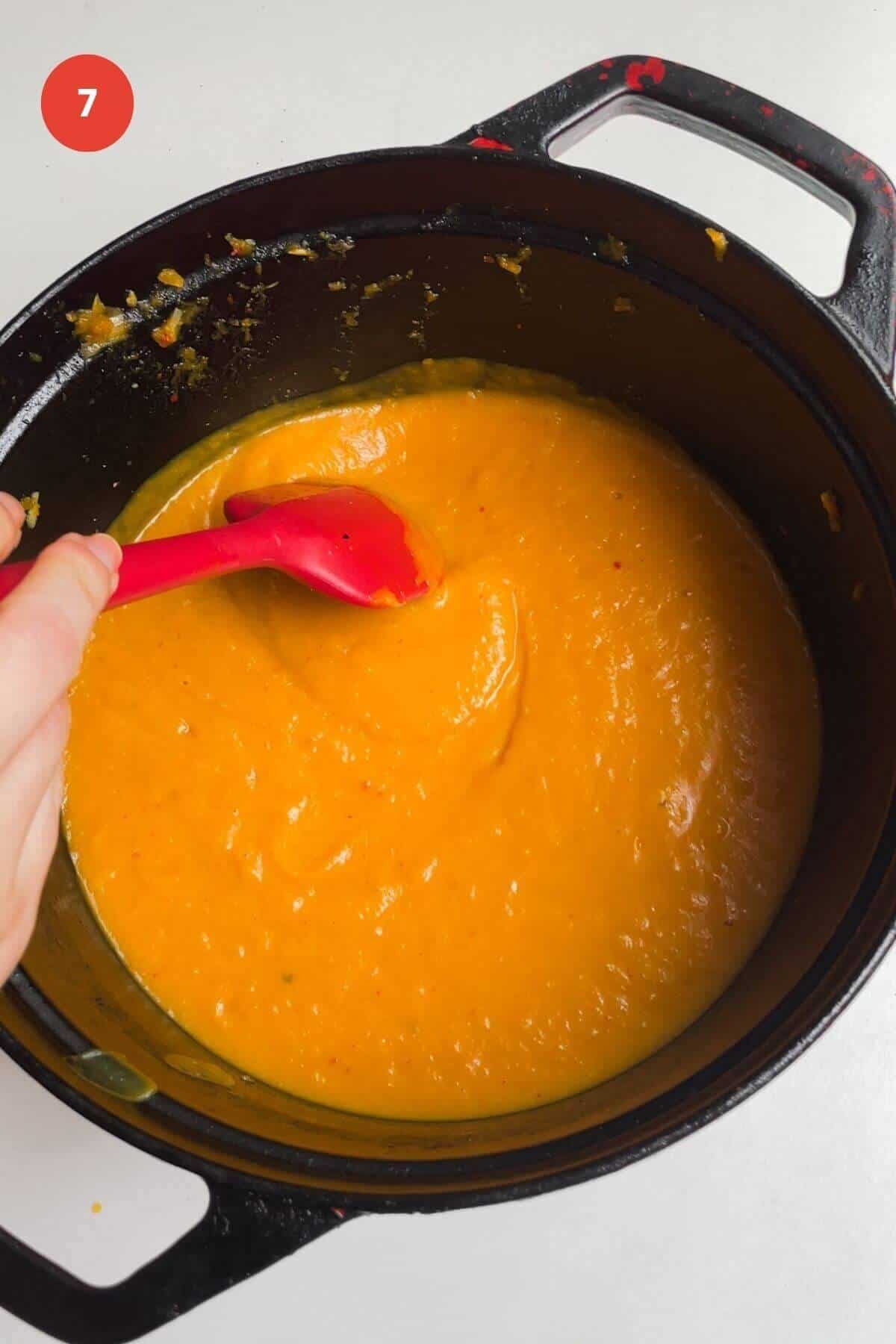 Creamy, smooth, blended butternut squash soup in pot.