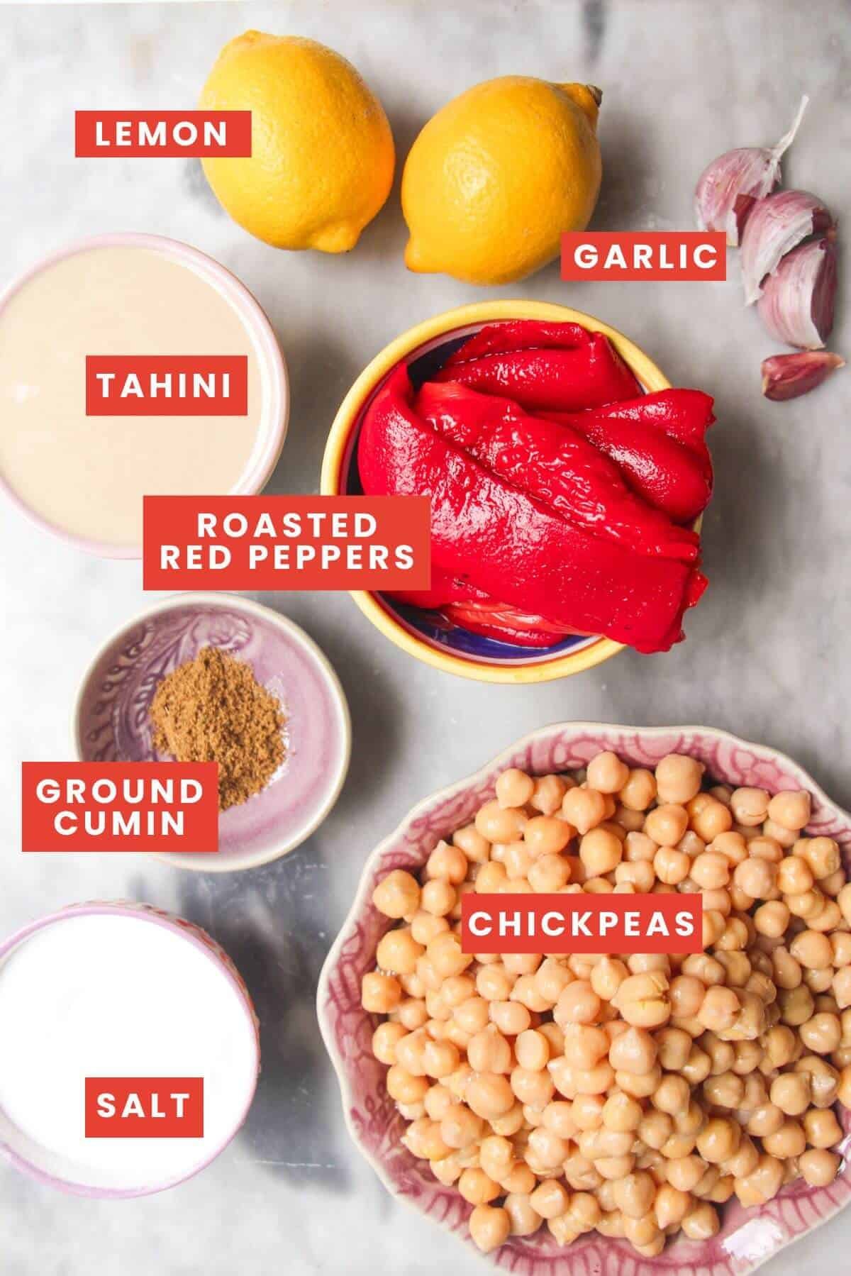 Ingredients for red pepper hummus laid out and labelled.