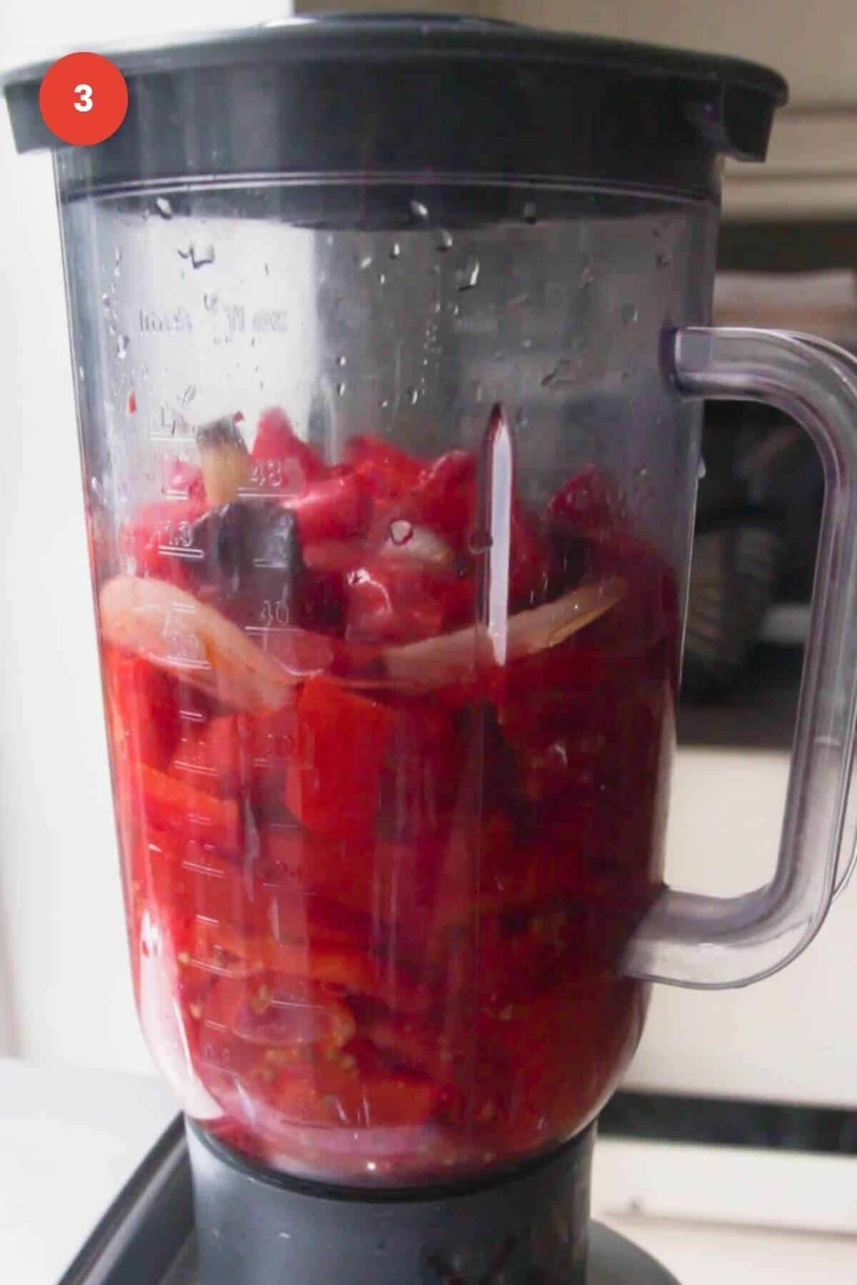 Roasted tomatoes, bell peppers, garlic and onion in a blender.
