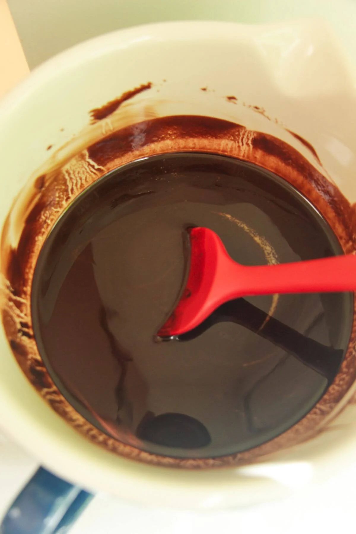 Melted chocolate and butter in a mixing bowl.