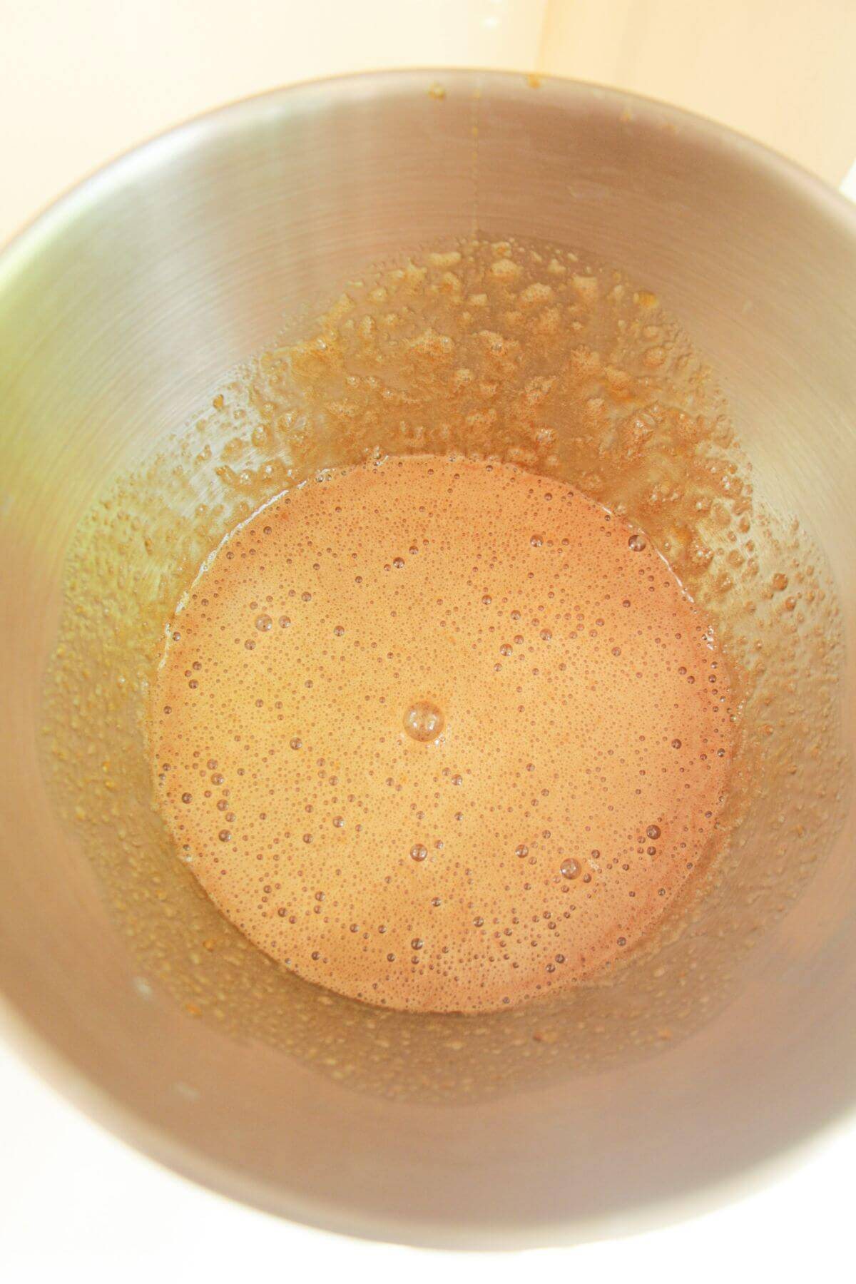 Eggs and sugar beaten in a large mixing bowl.