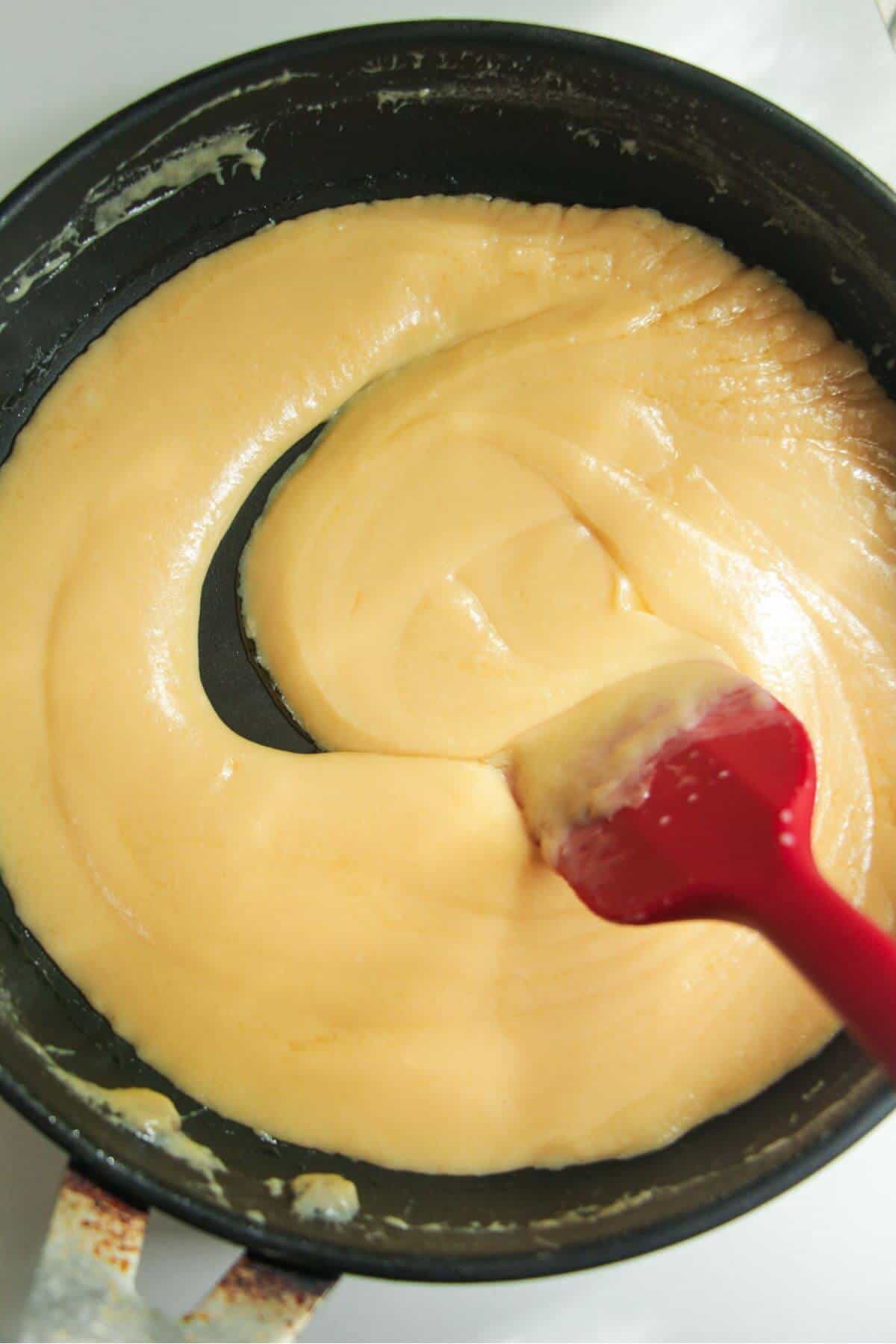 Salted caramel thickened in a small pan.