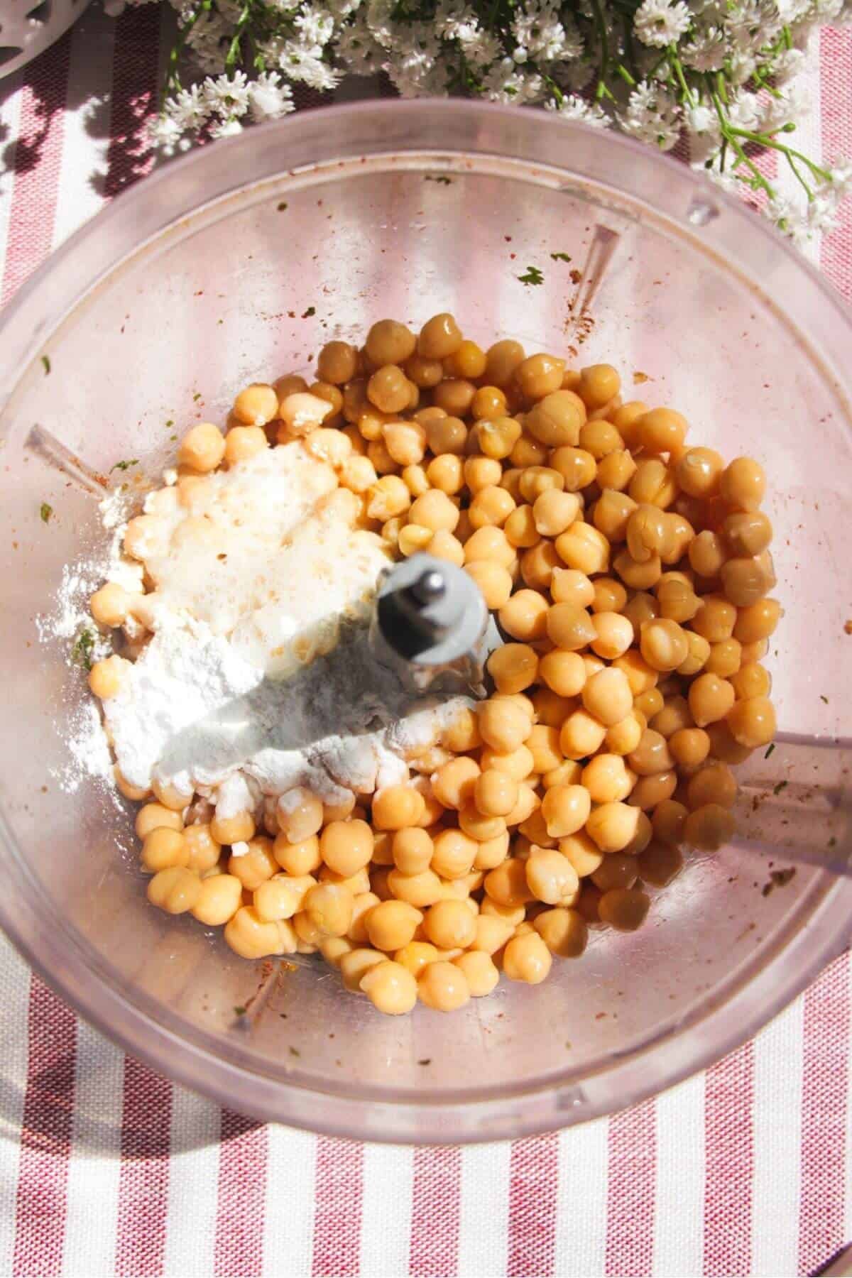 Chickpeas and flour added to food processor.