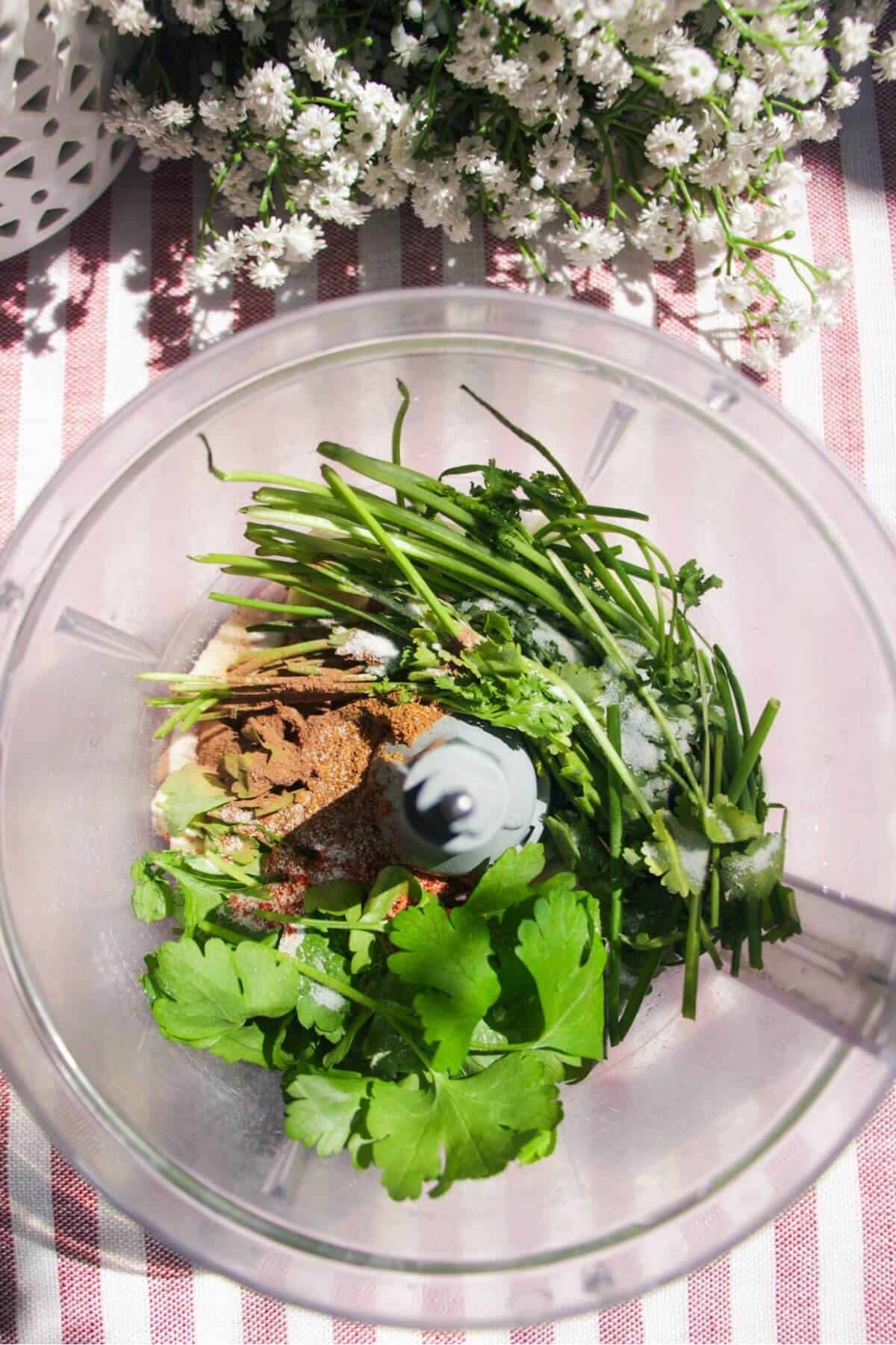Herbs, spices, onion and garlic in a good processor.