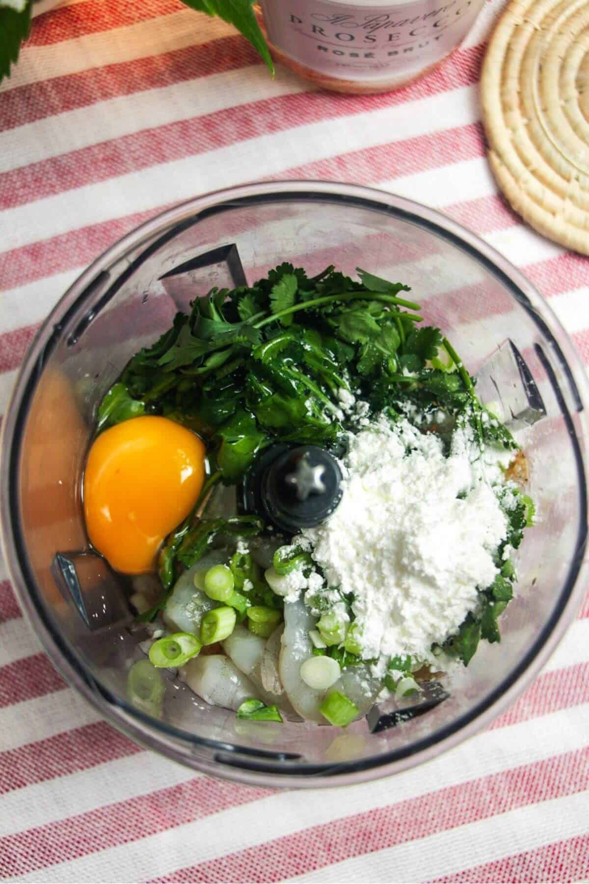 Ingredients for prawn toast tacos in food chopper.