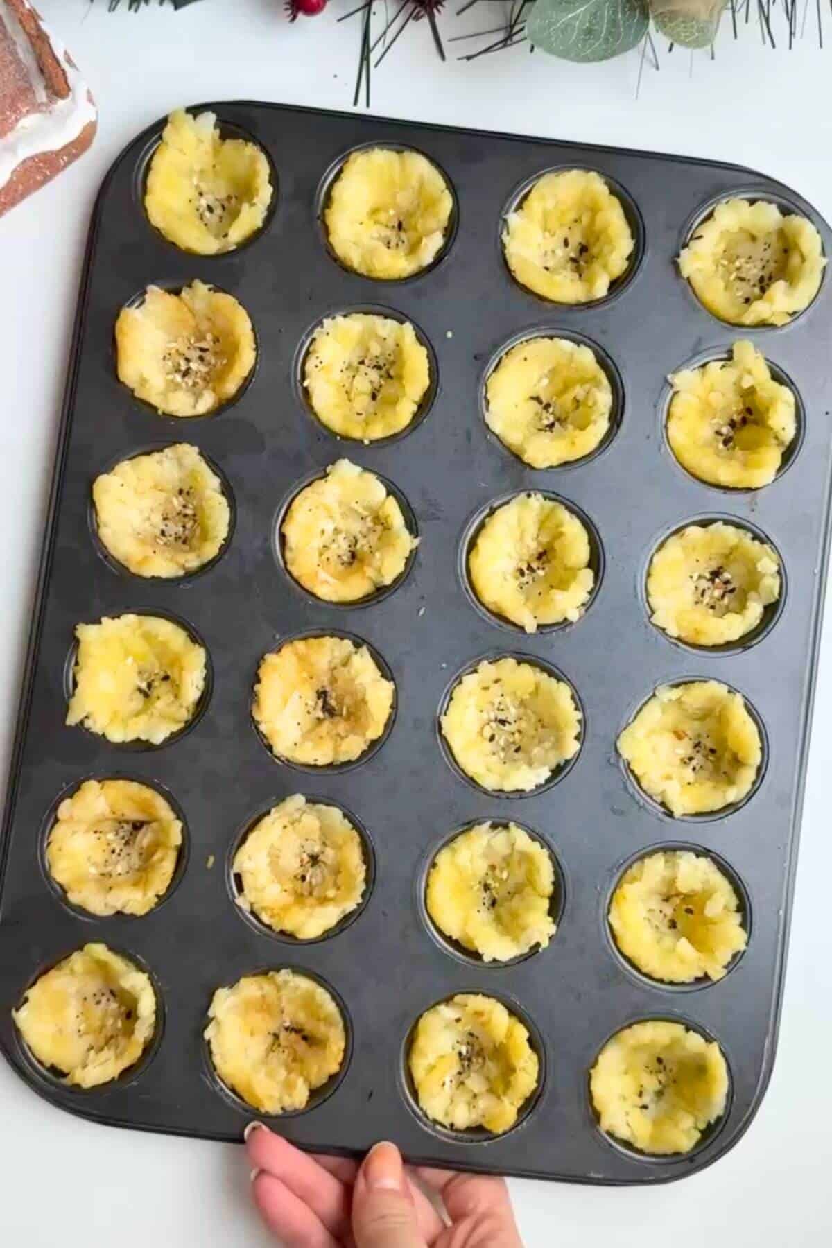 Hash brown cups ready for baking.