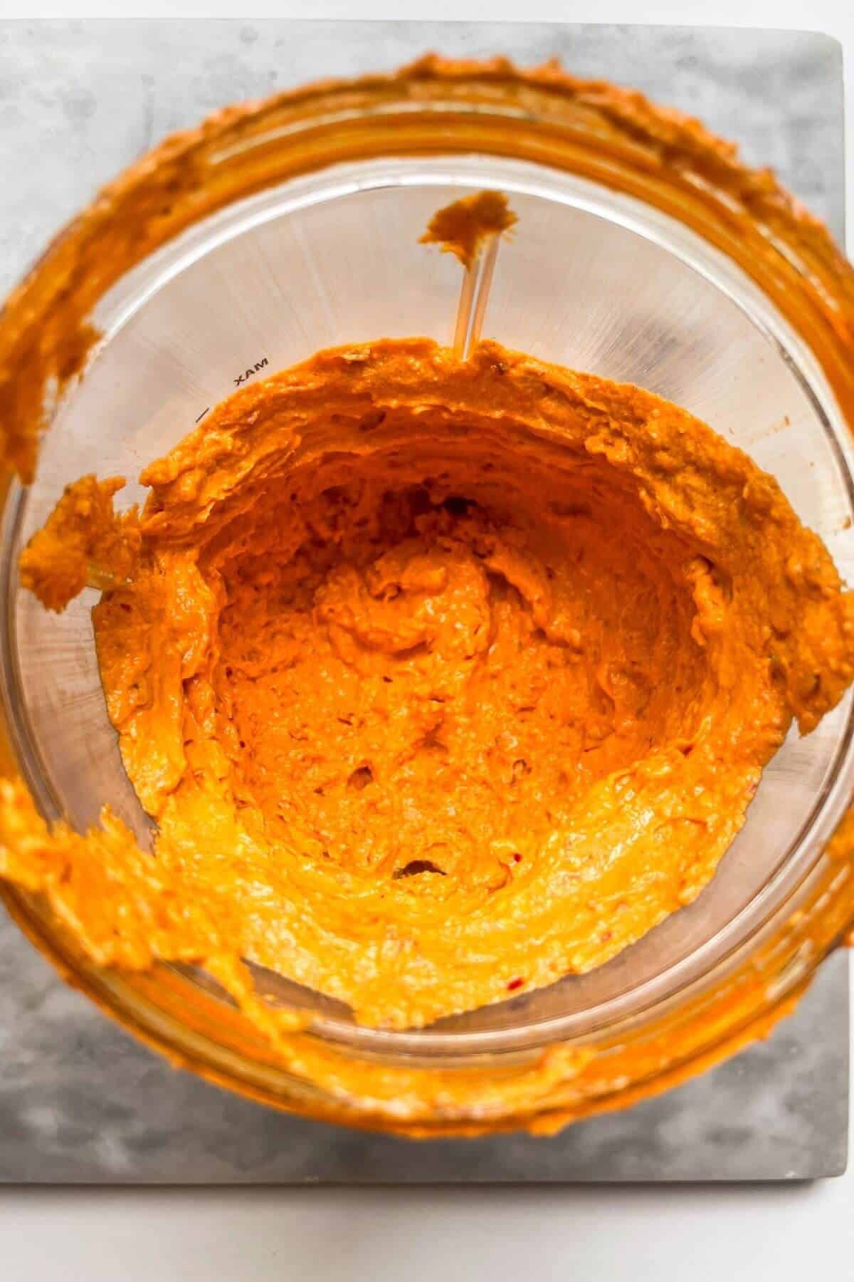 Smooth, blitzed spicy feta dip in a blender.