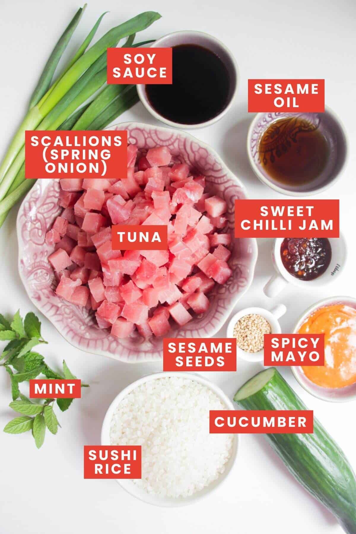 Ingredients for tuna poke bowls laid out and labelled.