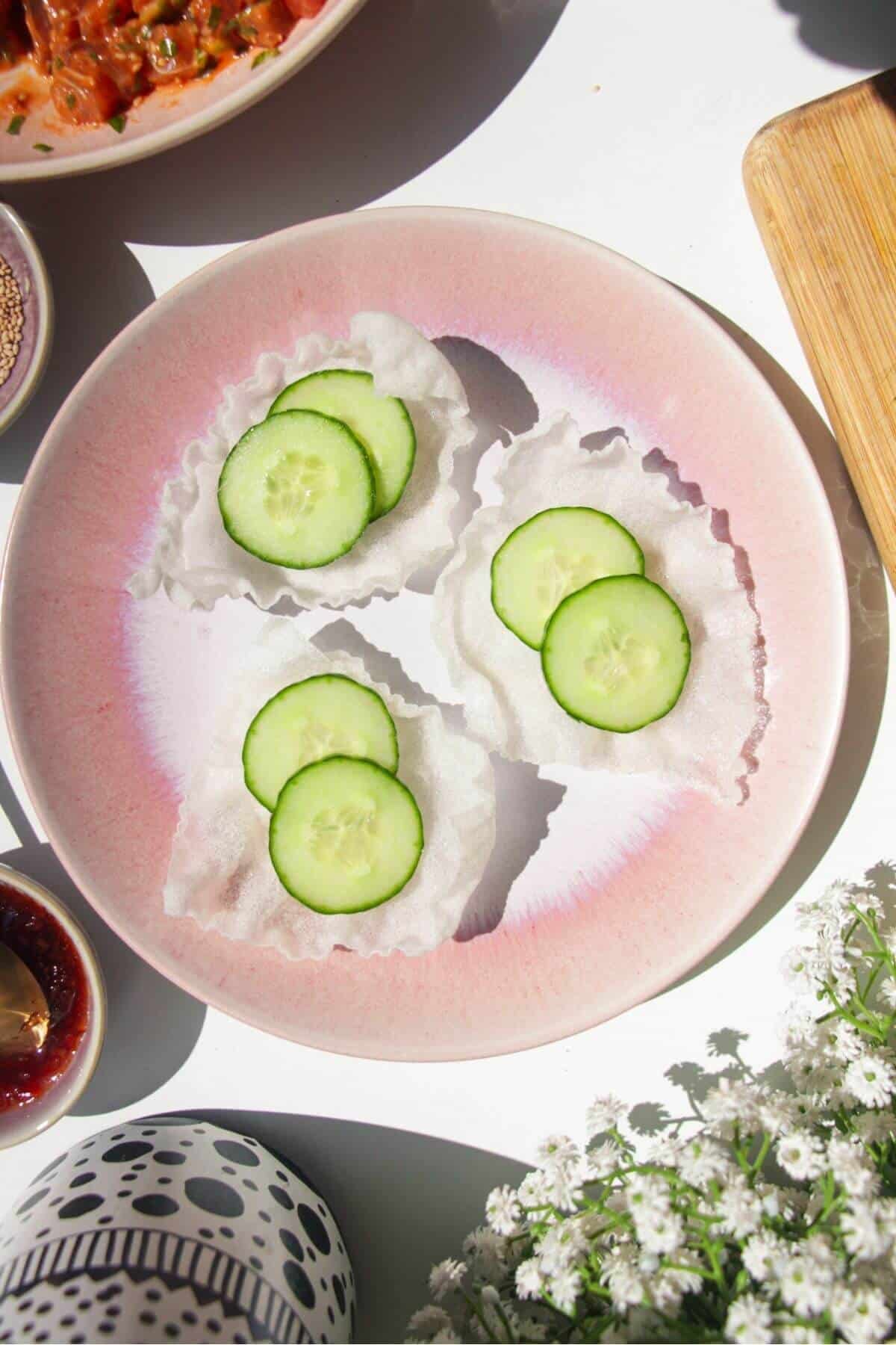 Cucumber slices in crispy rice paper cups.