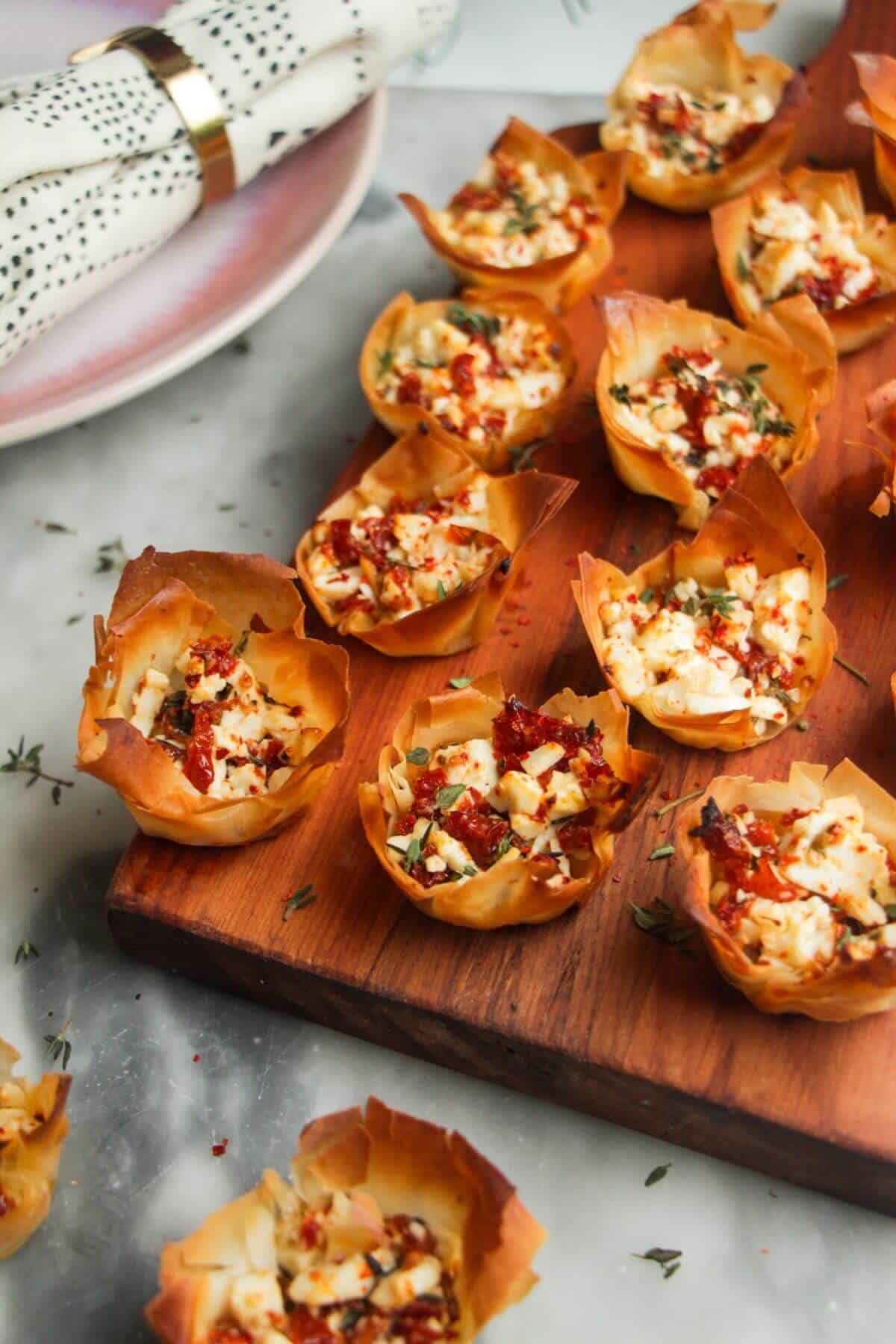 Close up of baked sundried tomato feta filo cups.