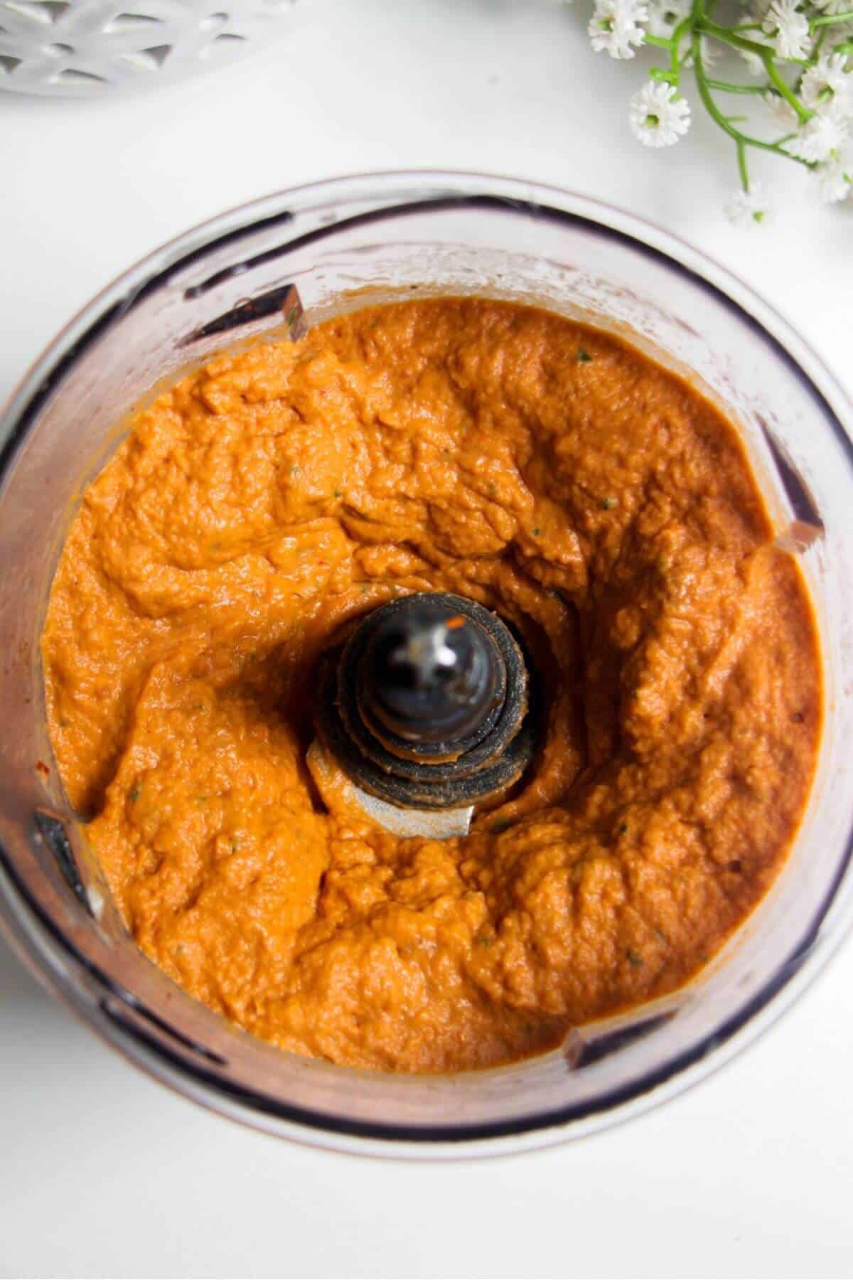 Sundried tomato basil hummus blitzed in a food chopper.