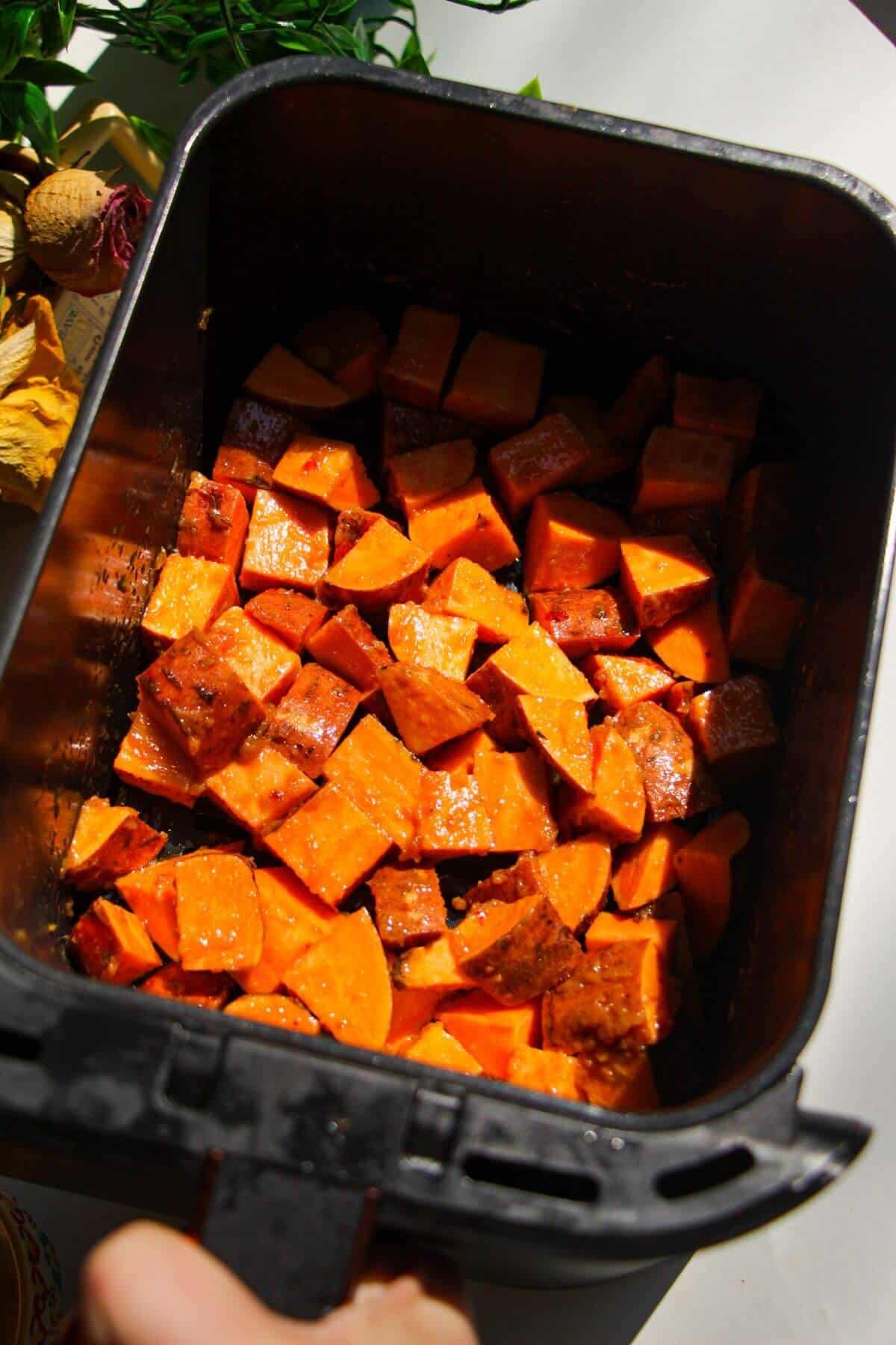 Cubed sweet potatoes tossed with miso and olive oil.