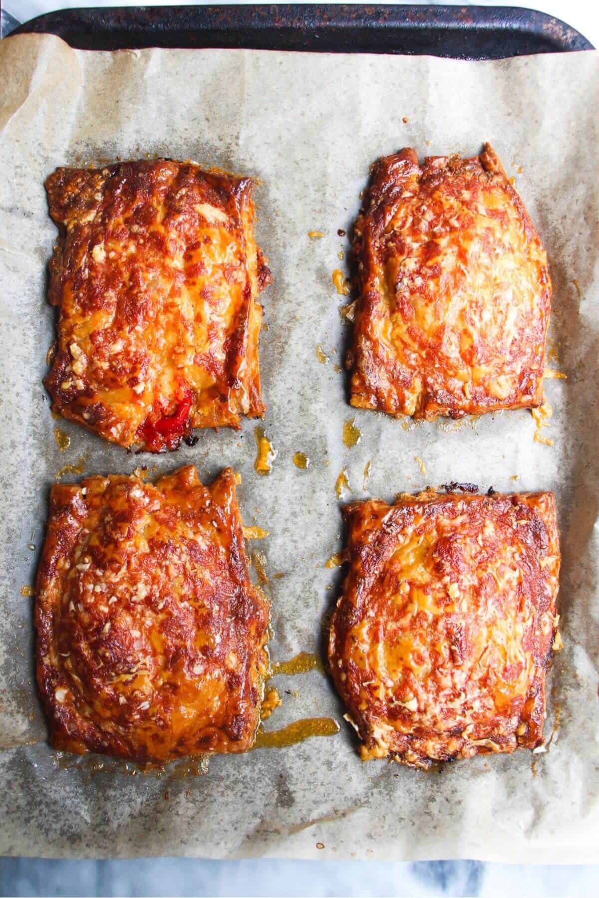 Golden, crispy upside down pizza tarts after baking in the oven.