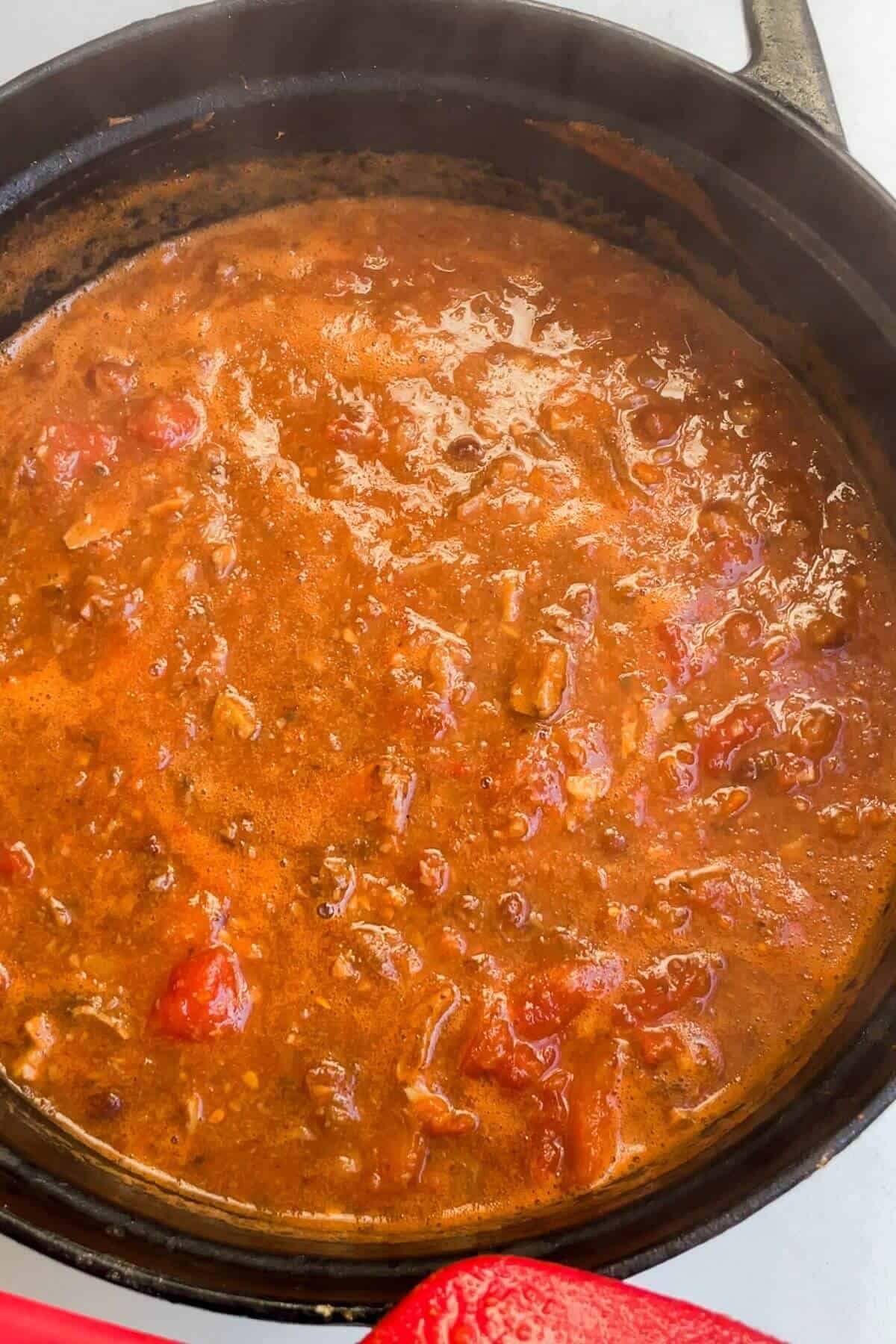 Lasagna soup thickened in a large pot.