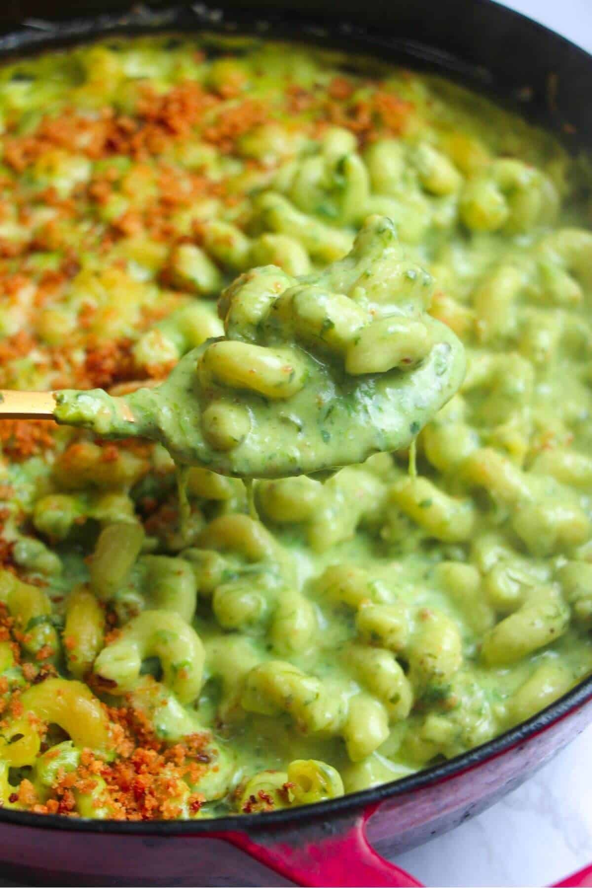 Close up of wild garlic mac and cheese on a spoon.