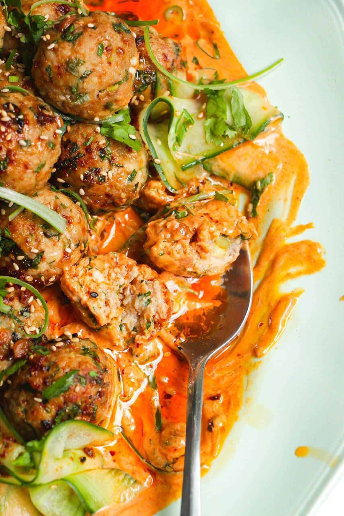 Close up of dumpling meatball open on spoon.