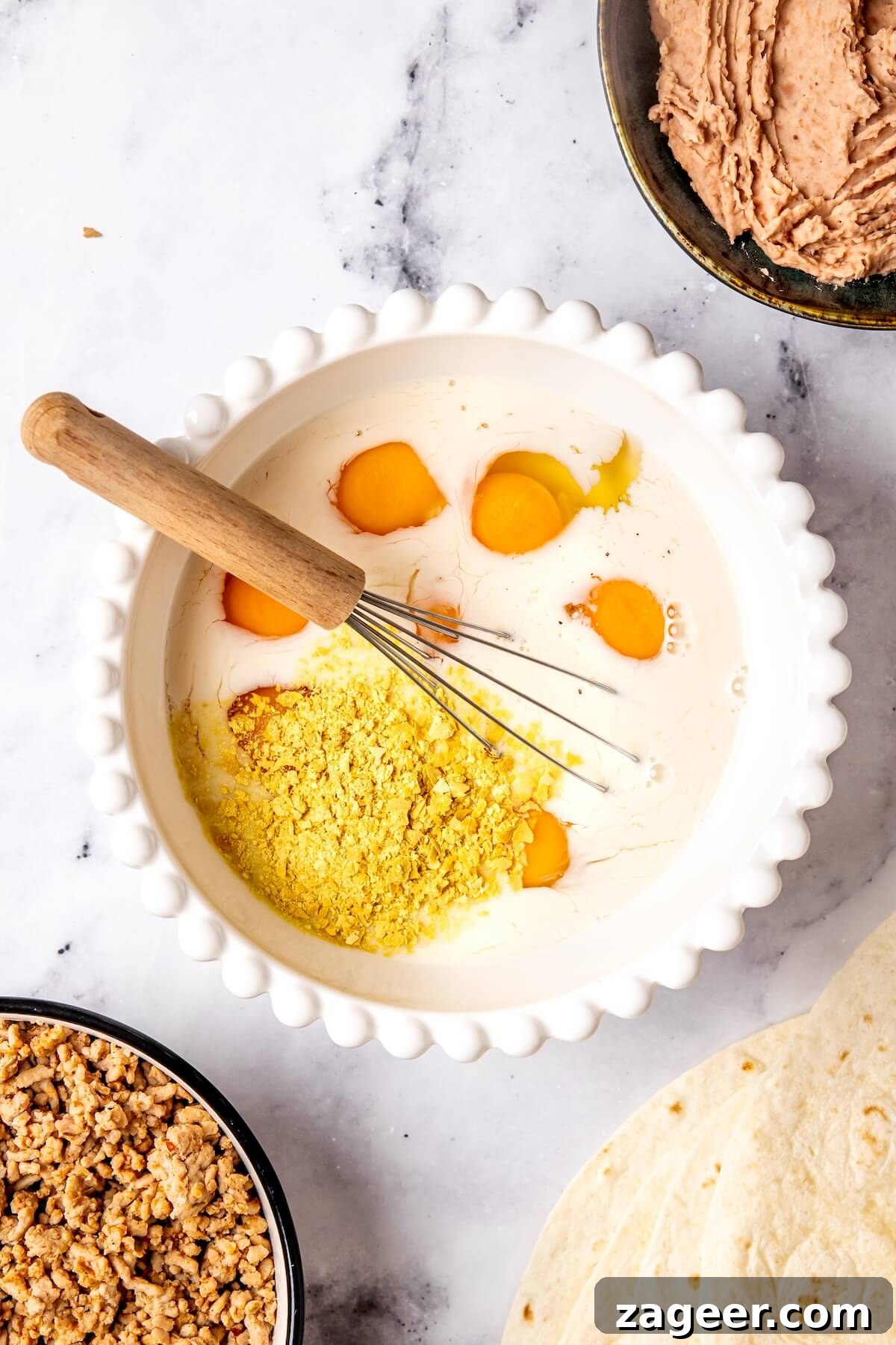 Your Go-To Gluten-Free Frozen Breakfast Burritos 10 Cooking Scrambled Eggs with Veggies for Burritos - Olivia Adriance