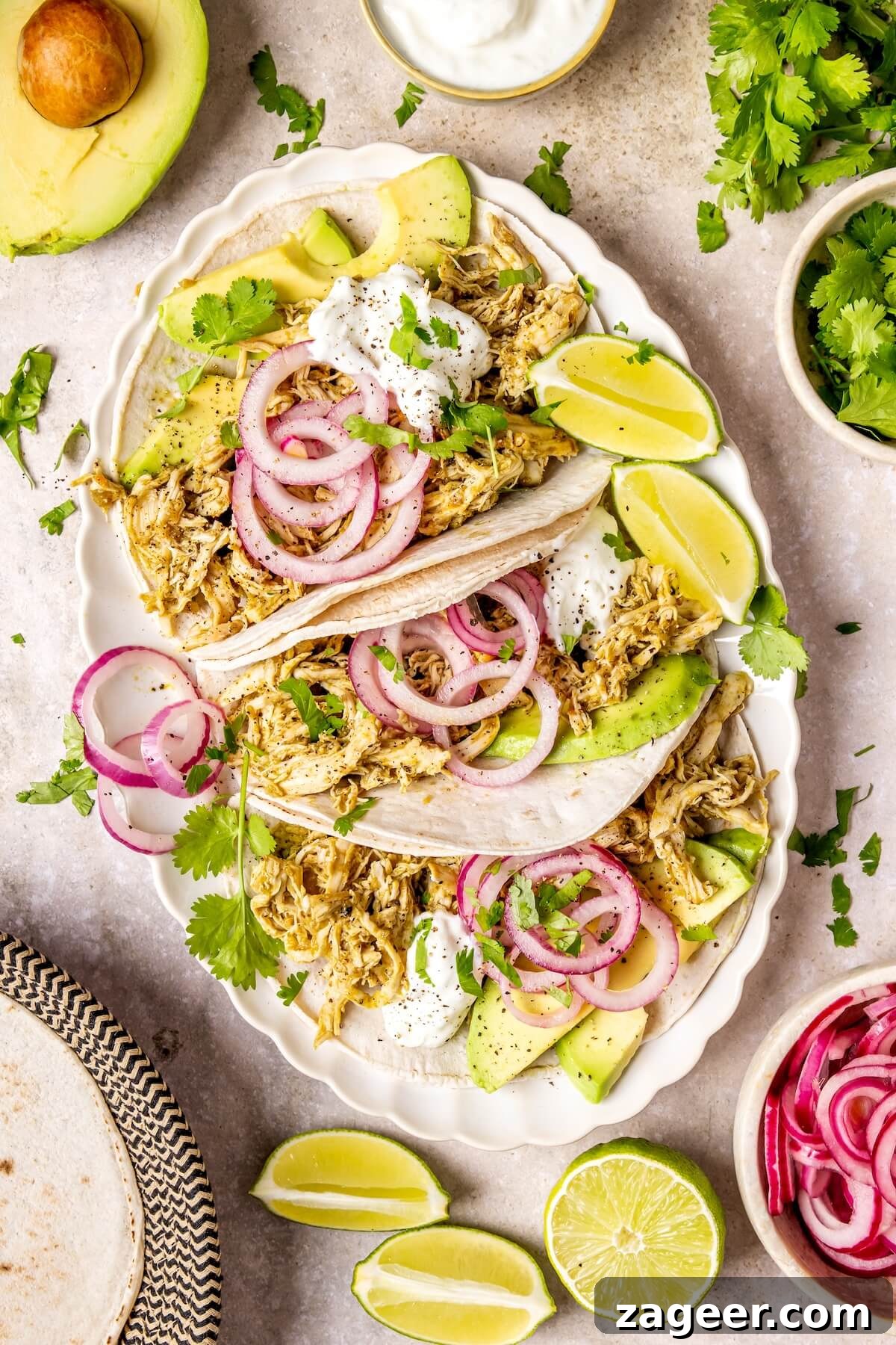 Zesty Slow Cooker Salsa Verde Chicken Tacos 3 Slow Cooker Salsa Verde Chicken Tacos served in soft tortillas