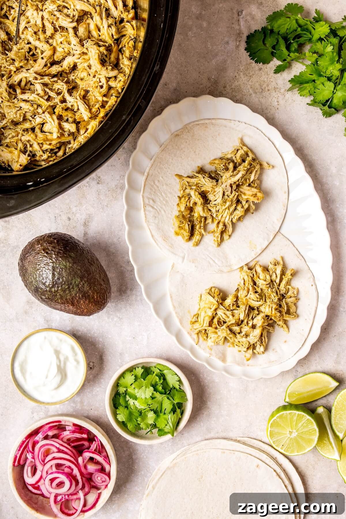 Zesty Slow Cooker Salsa Verde Chicken Tacos 10 Final plated Slow Cooker Salsa Verde Chicken Tacos with toppings