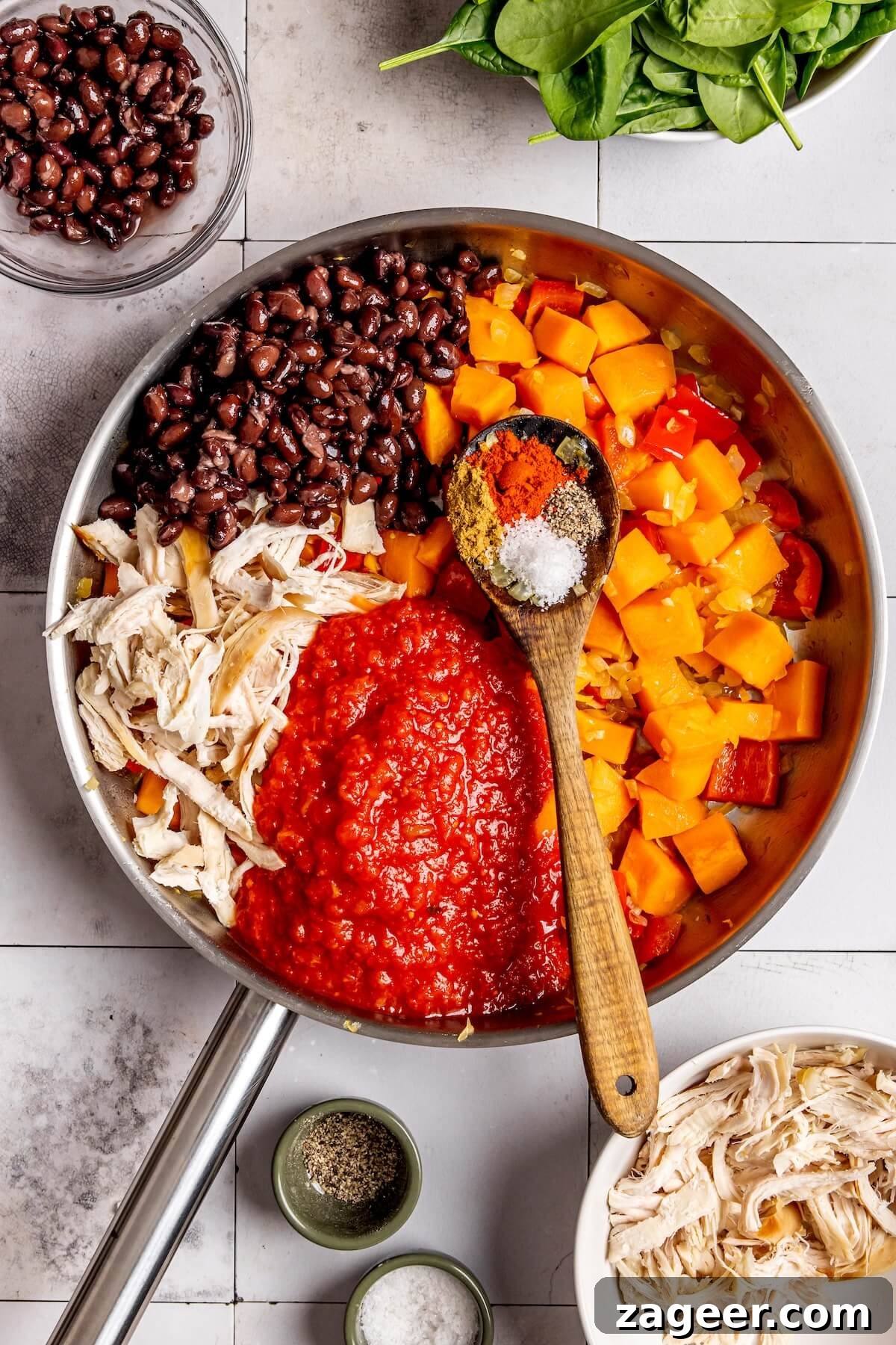 Fiesta Chicken Enchilada Skillet 11 Mixing in black beans, chicken, and enchilada sauce