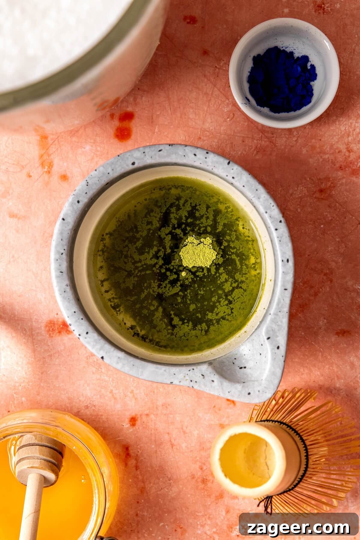 Verdant Matcha Elixir 10 Pouring whisked matcha over ice in a glass