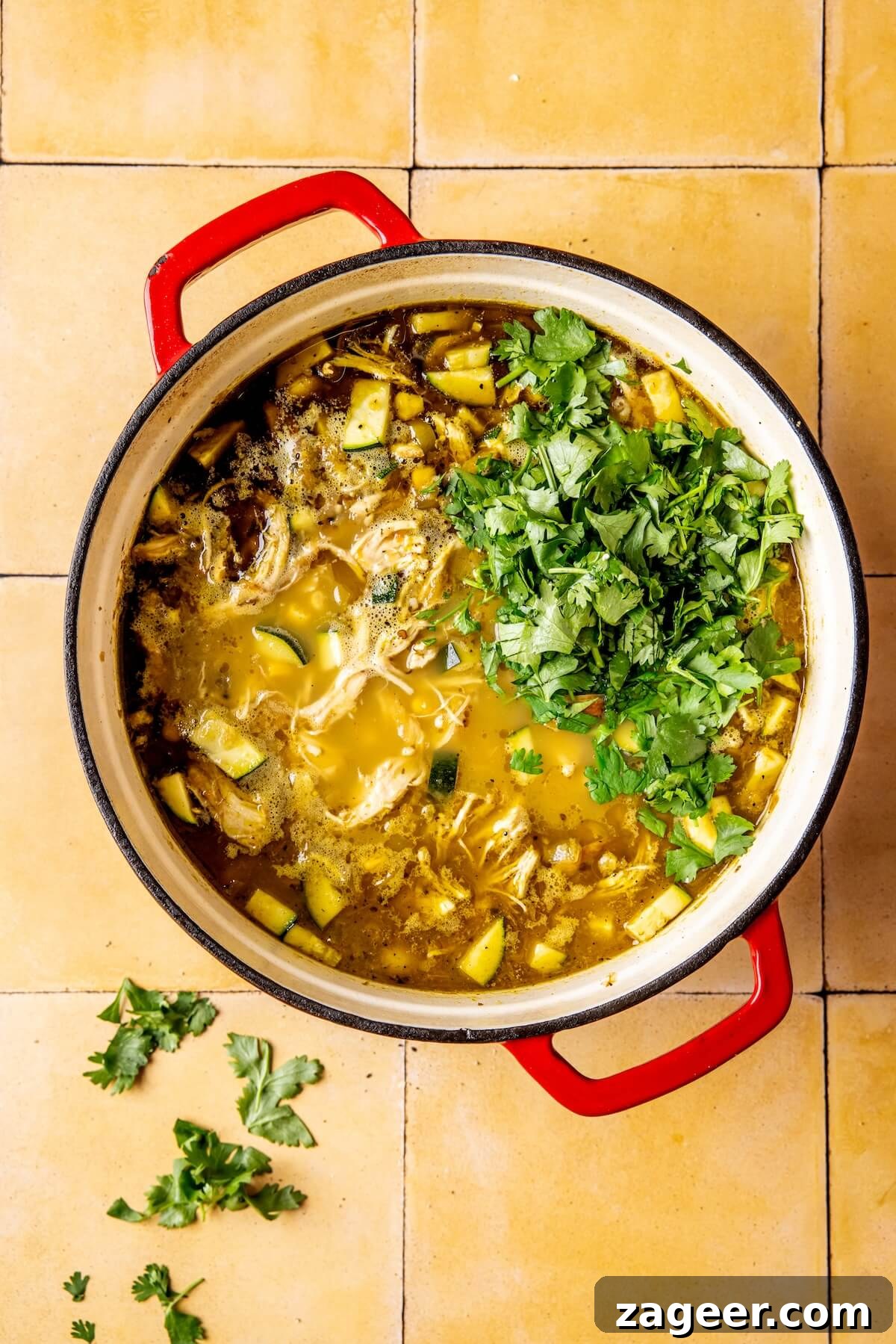 Vibrant Chicken Chili Verde 11 Adding shredded chicken, zucchini, corn, and beans back into the chili pot.