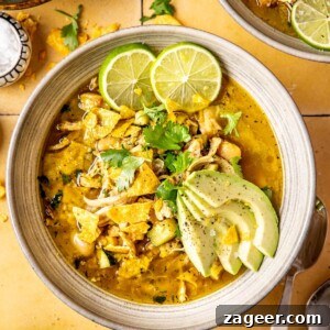 A bowl of Loaded Veggie Salsa Verde Chicken Chili, garnished and ready to serve.