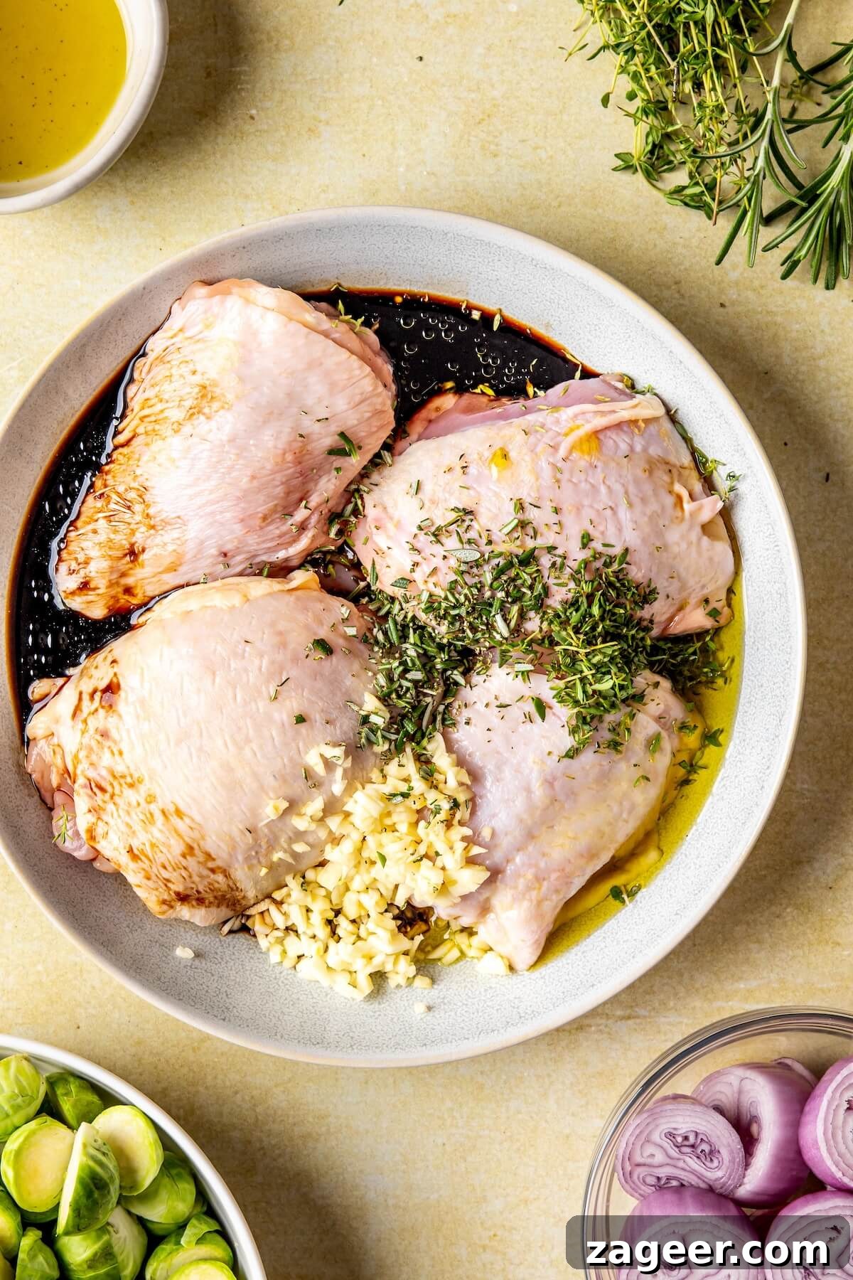 One-Pan Fall Chicken Feast 8 Step 1: Marinating chicken thighs with balsamic, garlic, and herbs