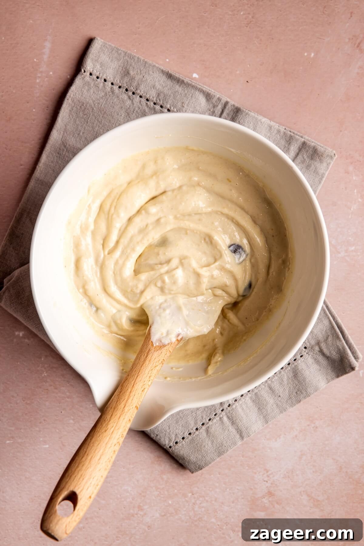 Step 2: Adding nut butter and chocolate chips to the yogurt mixture
