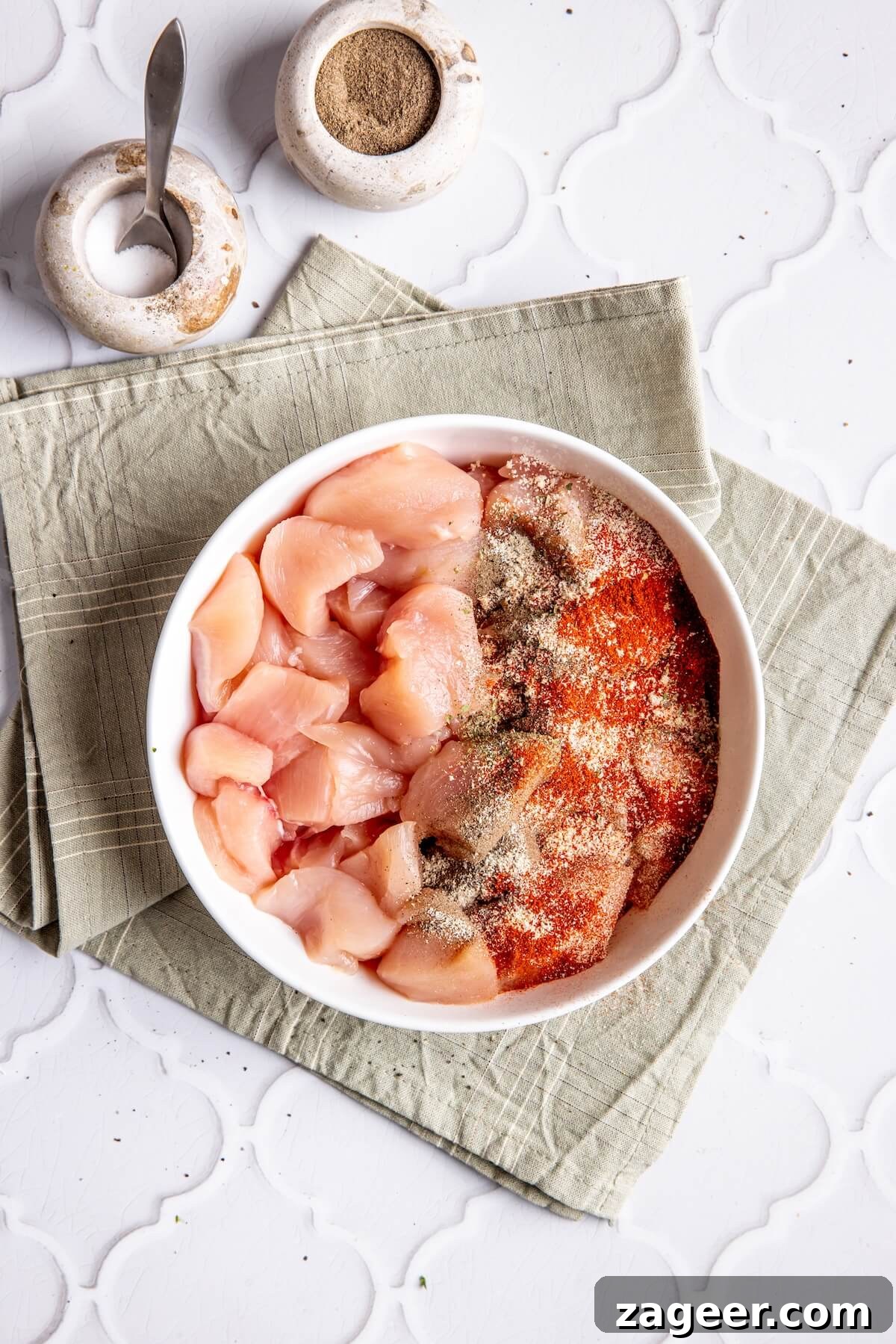 Ultimate Greek Chicken Bowl with Zesty Dairy-Free Tzatziki 12 Step 5: Cubed chicken breast seasoned with Greek spices, ready for cooking.