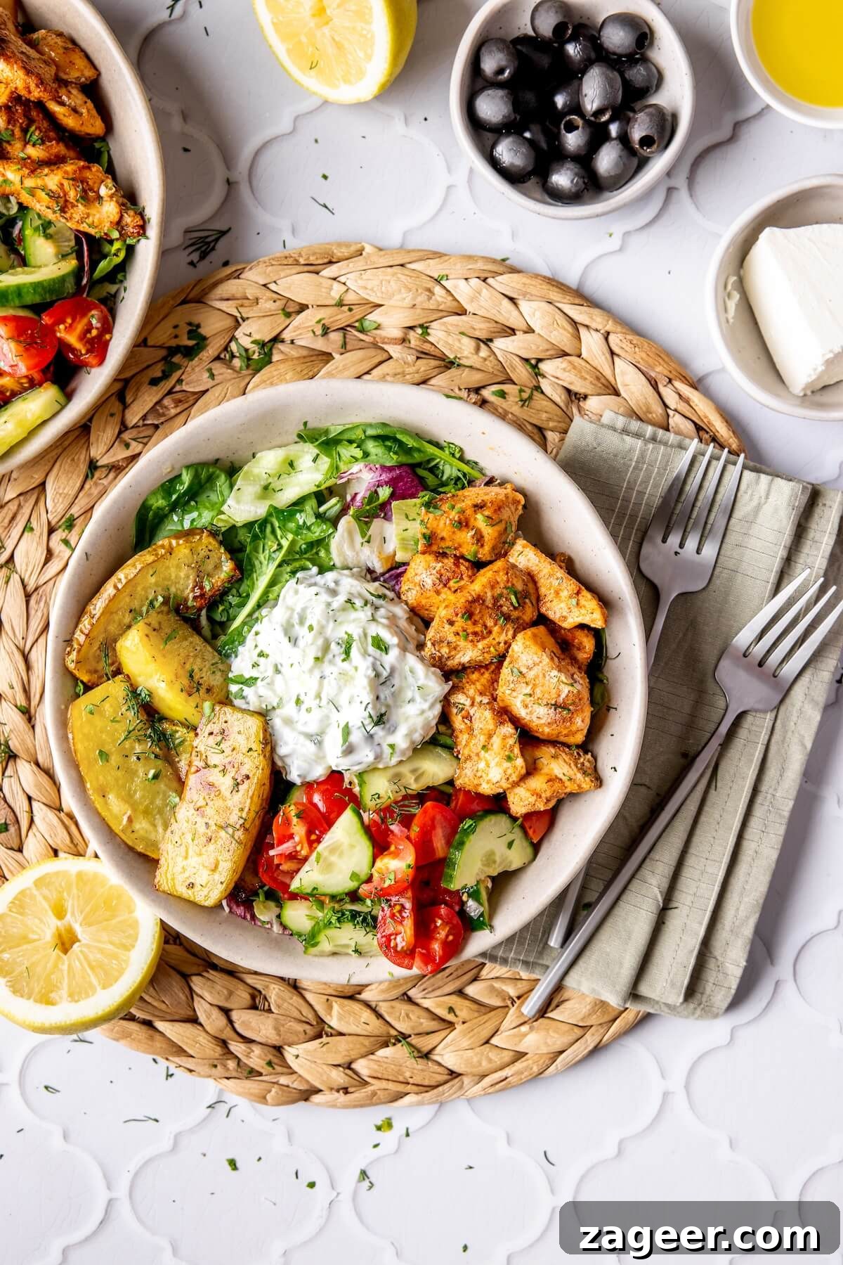 Ultimate Greek Chicken Bowl with Zesty Dairy-Free Tzatziki 5 A rustic shot of a Loaded Greek Chicken Bowl, emphasizing its homemade and fresh appeal.