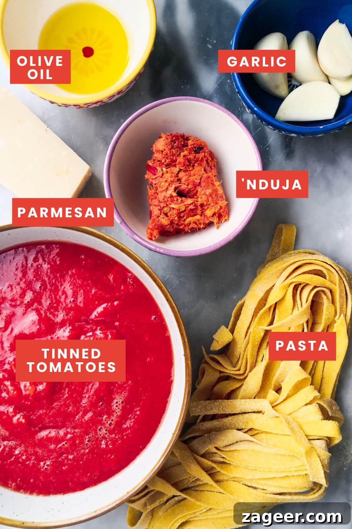 Quick Spicy Nduja Pasta with Creamy Burrata 3 Ingredients for nduja pasta laid out on a grey marble background and labelled clearly.