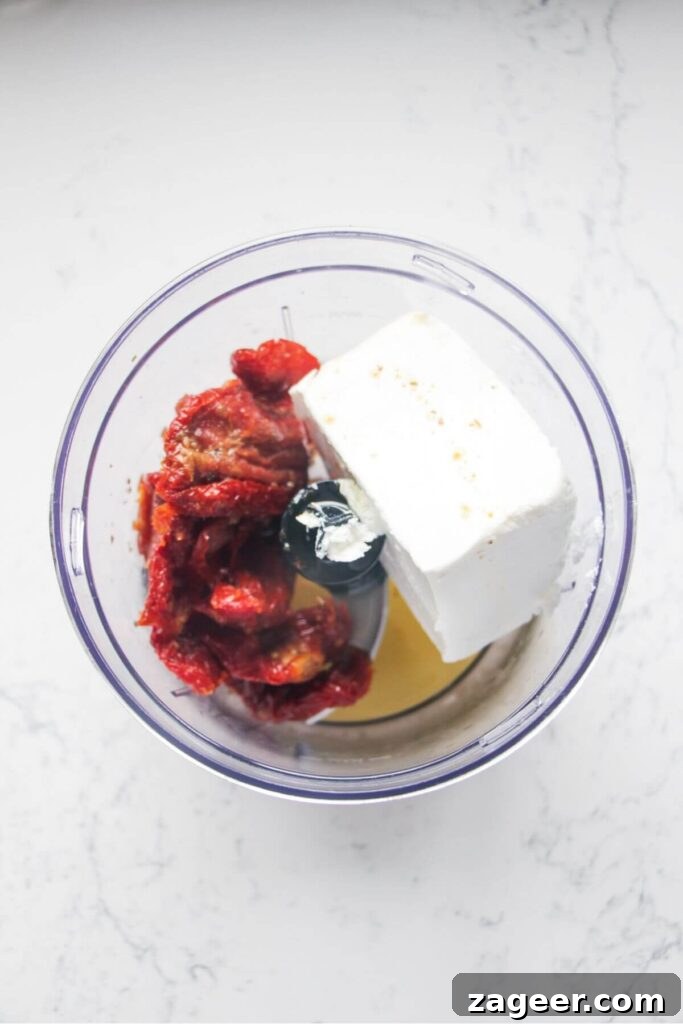 Instant Sun-Kissed Feta Dip 4 Sundried tomatoes, feta and oil in a small food chopper.