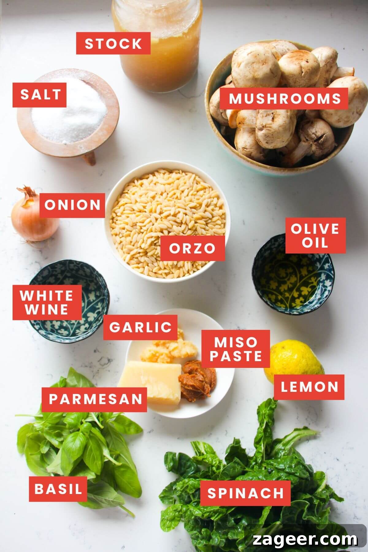Velvety One-Pot Mushroom Orzo 3 Ingredients for mushroom orzo laid out on a white marble background and labelled.