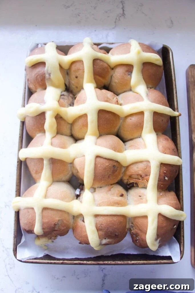 Easter Mini Egg Chocolate Hot Cross Buns 13 12 mini egg hot cross buns after baking in an oven tray.