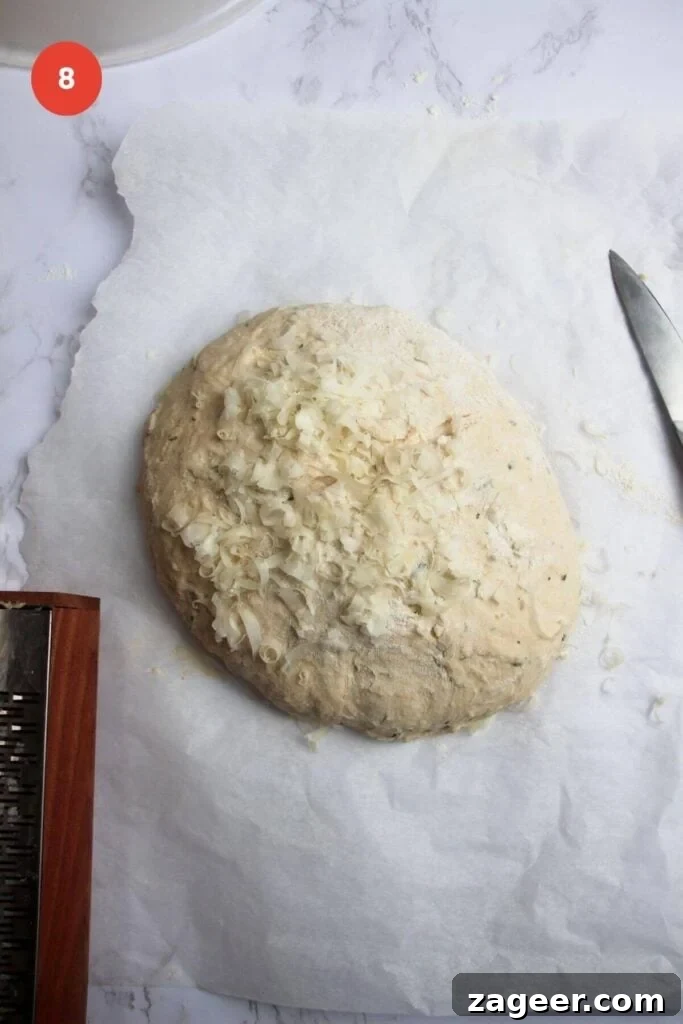 Artisan Style Rosemary Parmesan Bread Done Easy 11 Grated parmesan cheese on top of shaped bread dough.