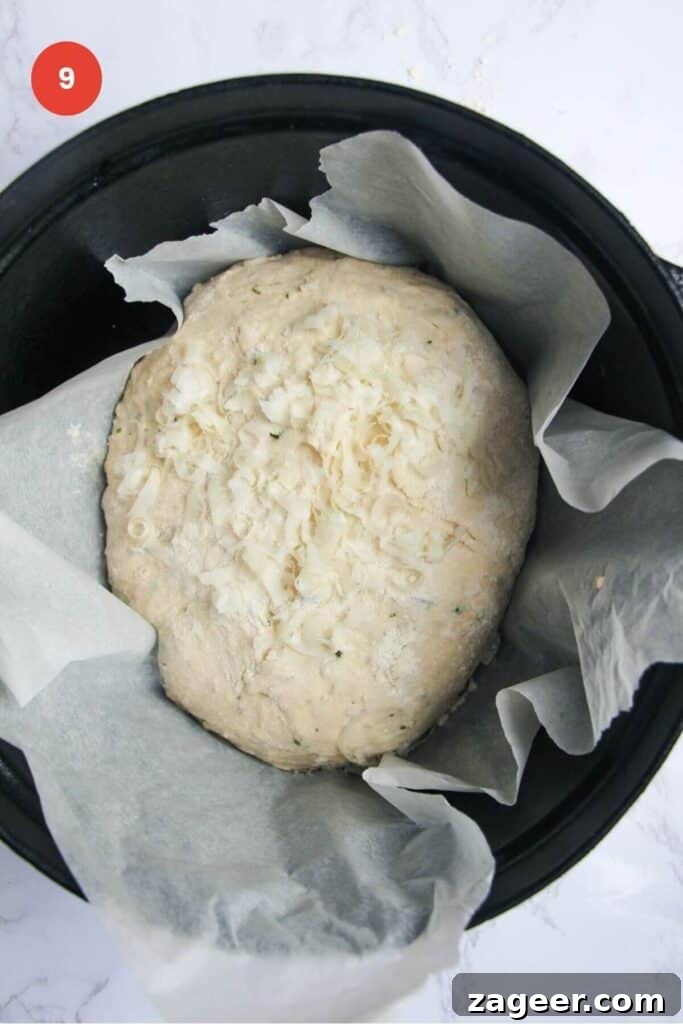 Artisan Style Rosemary Parmesan Bread Done Easy 12 Parmesan topped bread dough in Dutch oven.