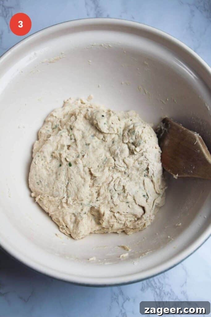 Artisan Style Rosemary Parmesan Bread Done Easy 6 Rosemary parmesan bread dough in bowl.