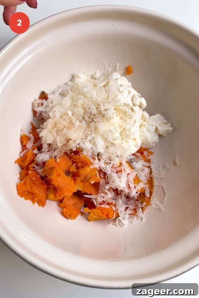 Effortless 5-Ingredient Sweet Potato Gnocchi 5 Sweet potato flesh, ricotta, parmesan in a mixing bowl.