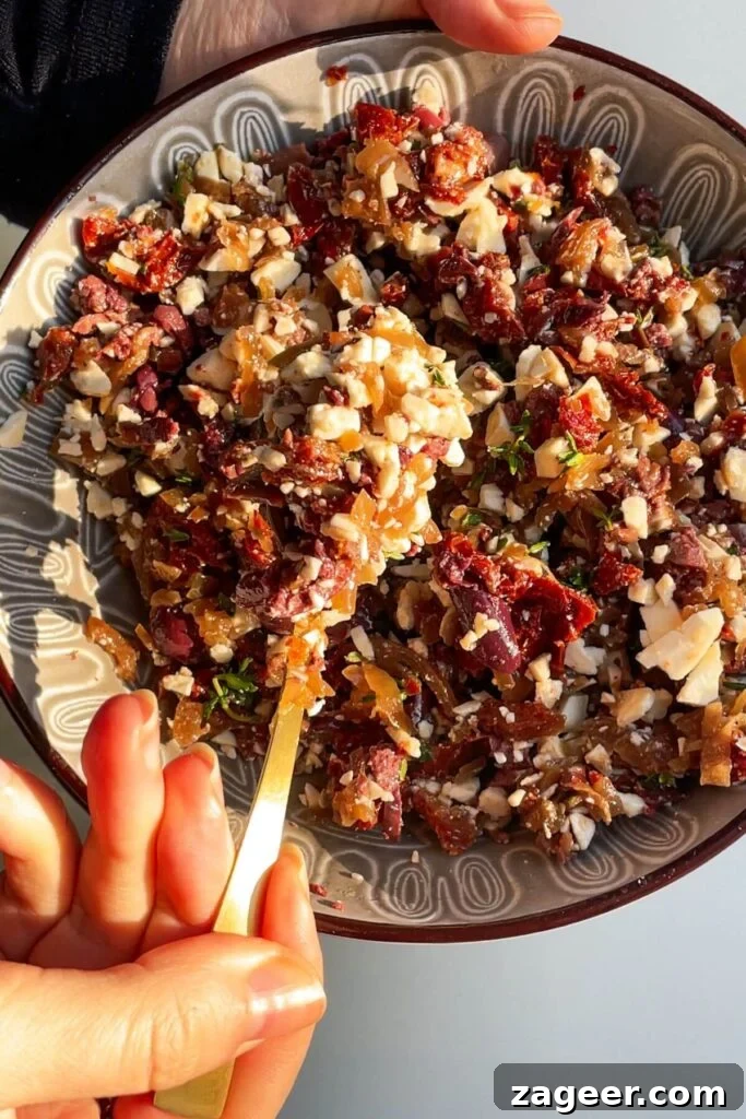 Loaded Antipasto Salami Crisps 7 The vibrant antipasti filling mixture, with feta, olives, sundried tomatoes, and onions, in a small bowl.