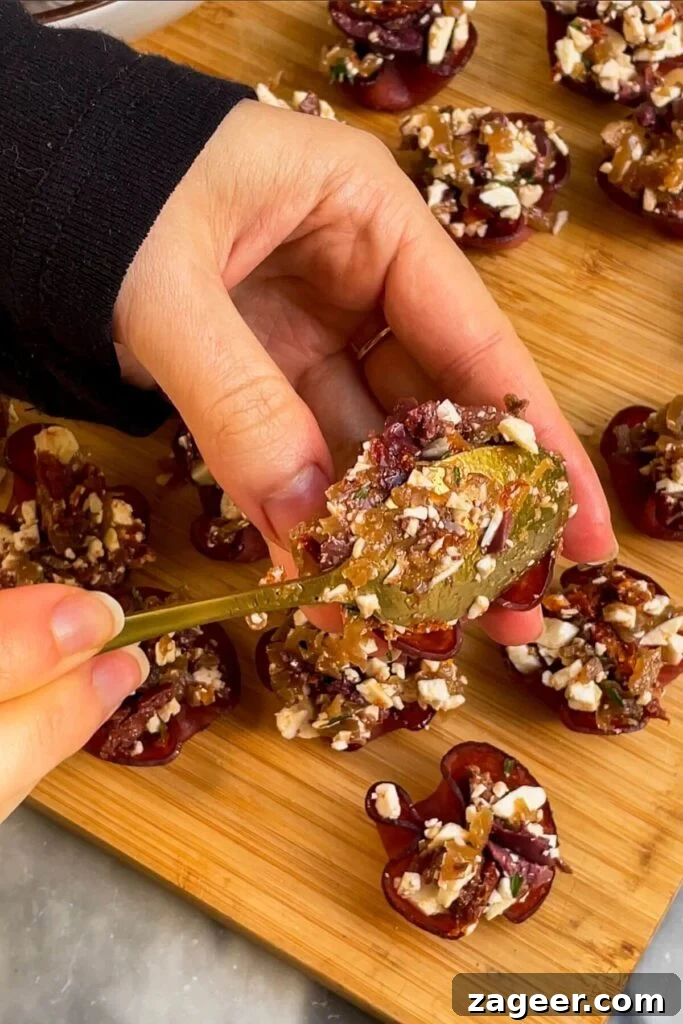 Loaded Antipasto Salami Crisps 8 Spoonful of antipasti filling being carefully placed into a crispy salami cup.