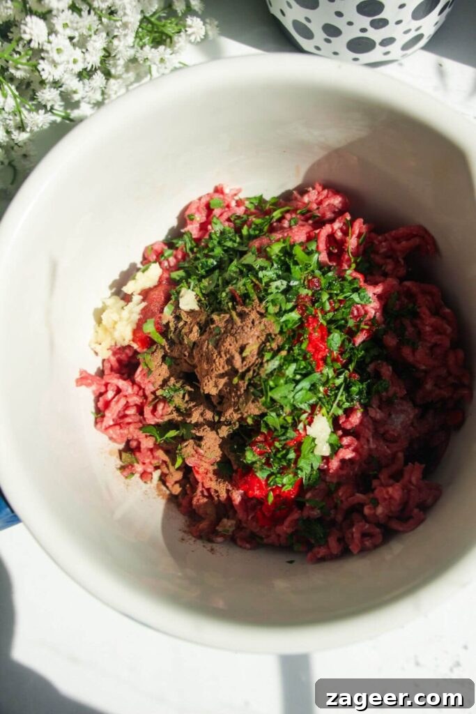 Effortless Lahmacun Smash Tacos 4 Well-combined ground meat and seasoning in a large mixing bowl, meticulously prepared for the tacos.