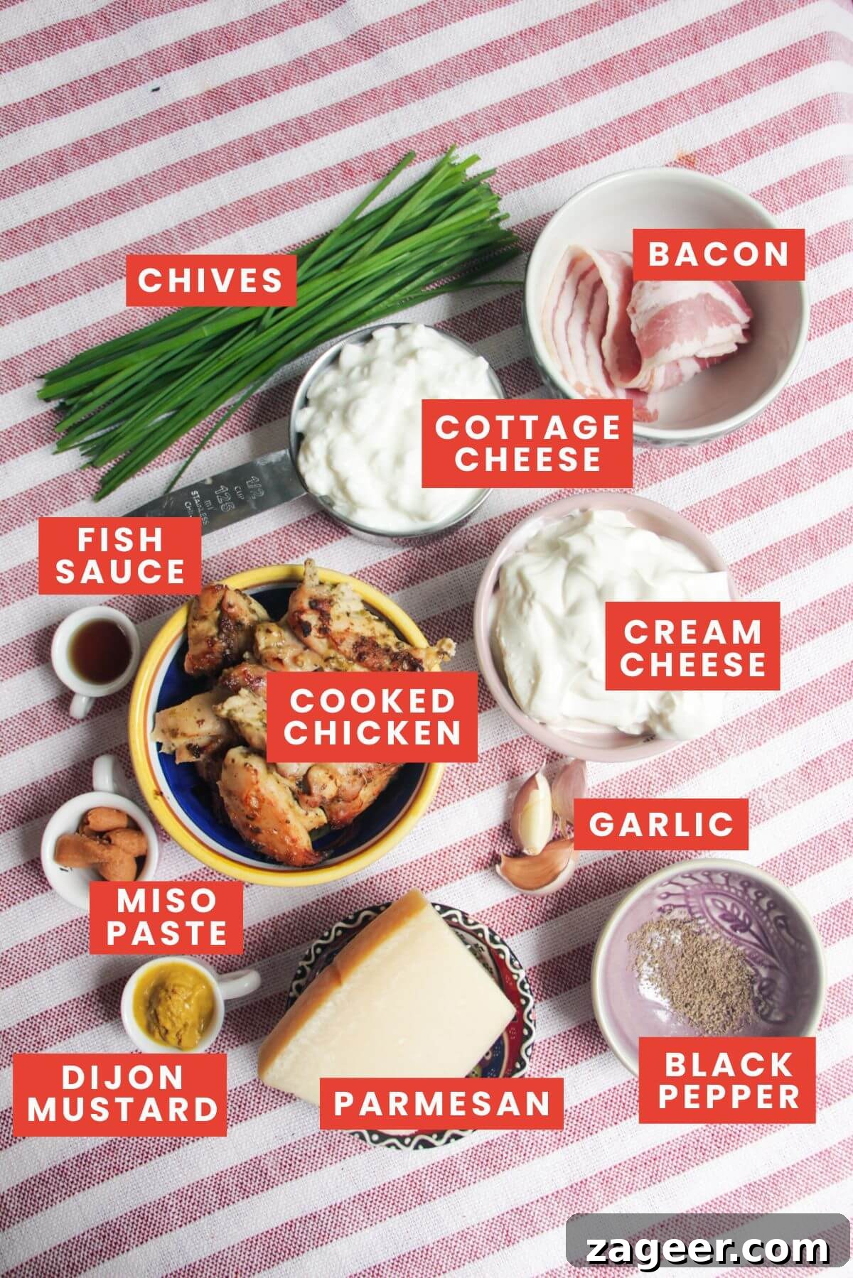 Decadent Chicken Caesar Party Dip 3 Key ingredients for chicken Caesar dip neatly arranged and labeled on a rustic wooden surface.
