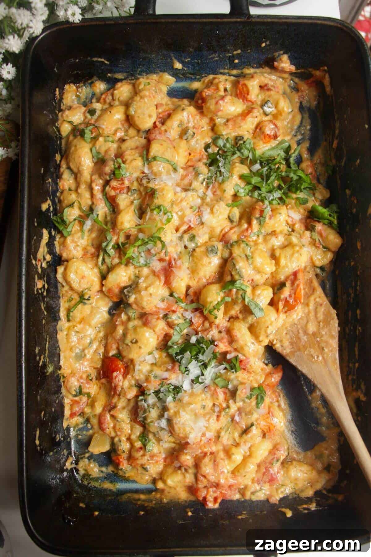 One Pan Creamy Boursin Gnocchi Bake 2 Baked Boursin gnocchi in an oven dish, ready to be served.